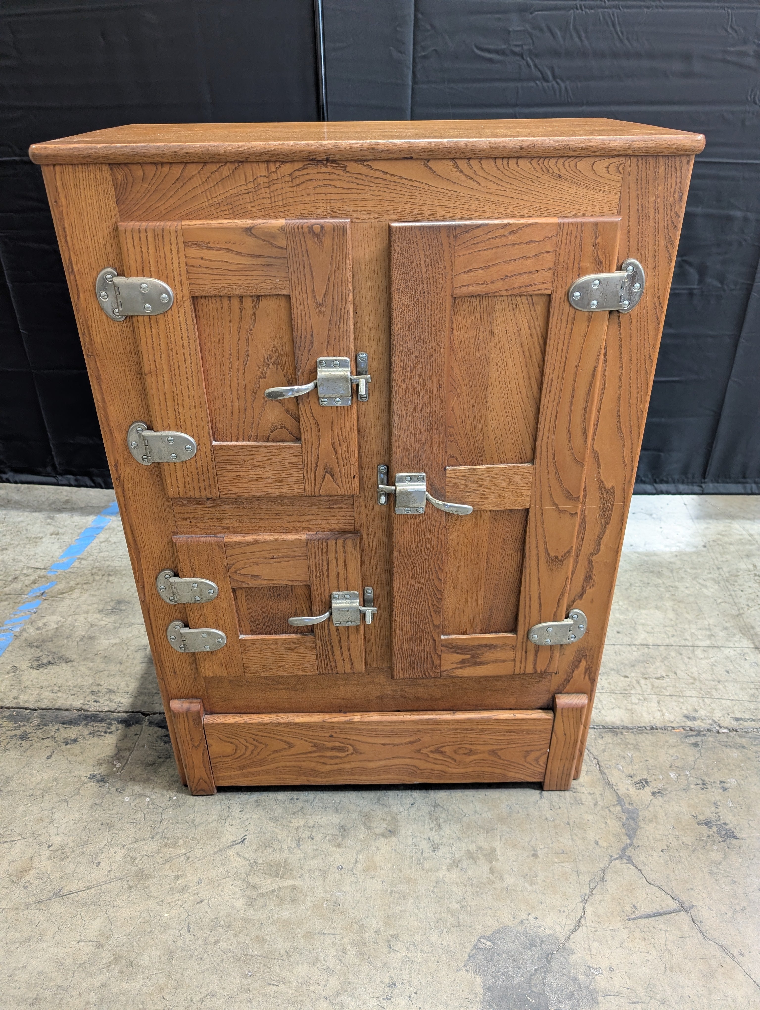Rustic Wood Storage Cabinet with Paneled Doors and Metal Latches