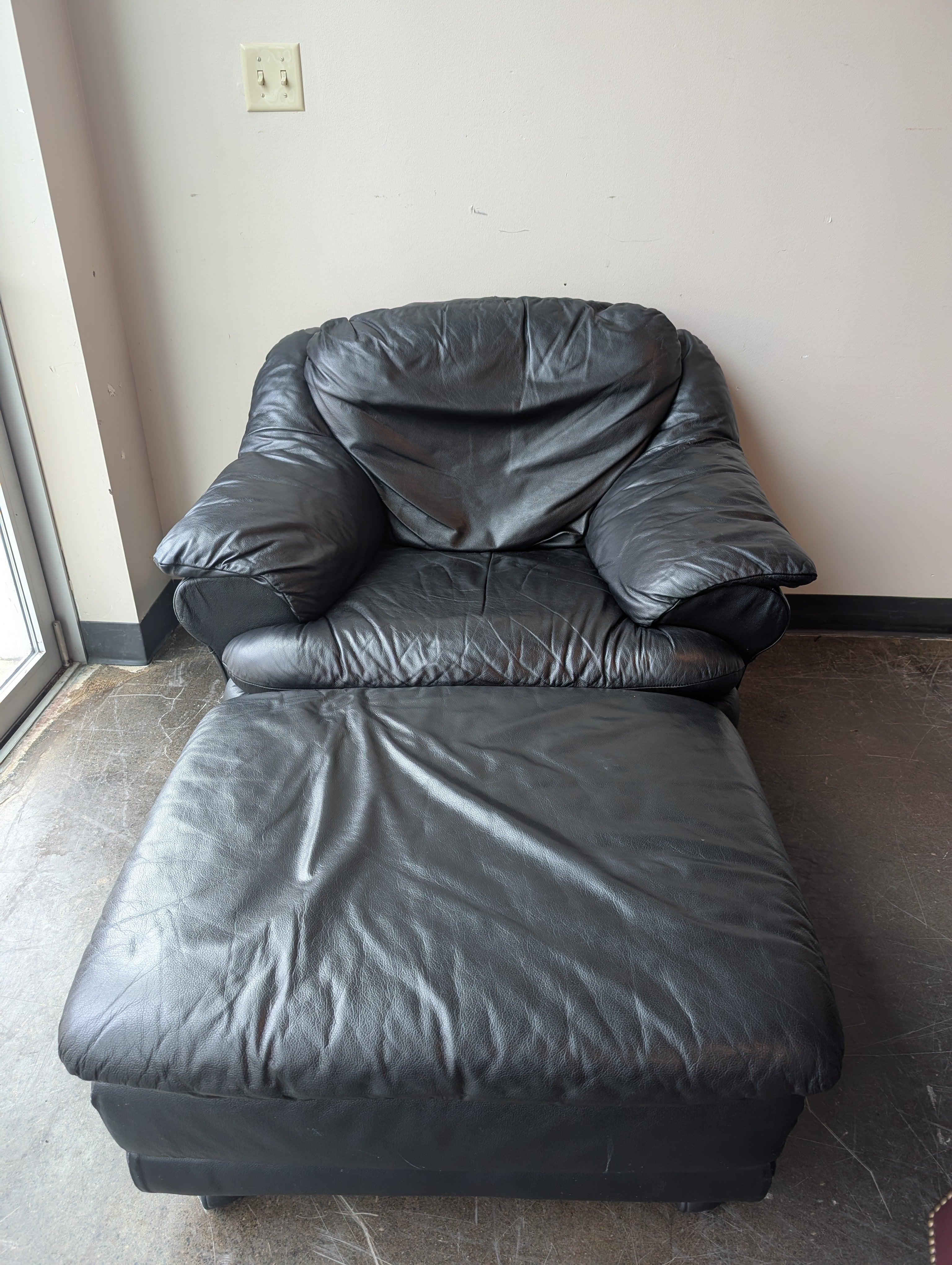 Plush Black Leather Armchair and Ottoman Set