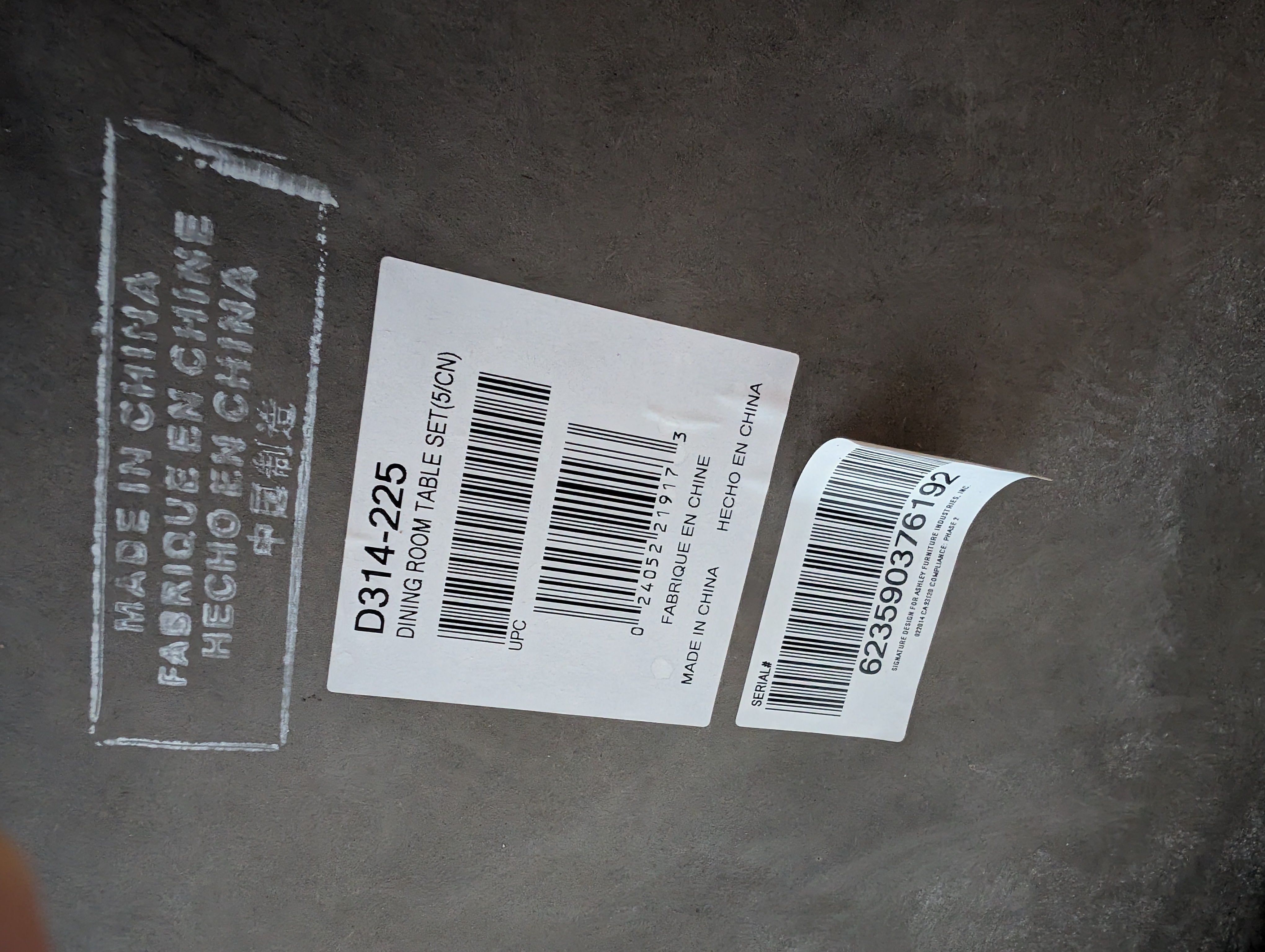 Round Stone Top Dining Table with Wood Trim and Metal Pedestal Base