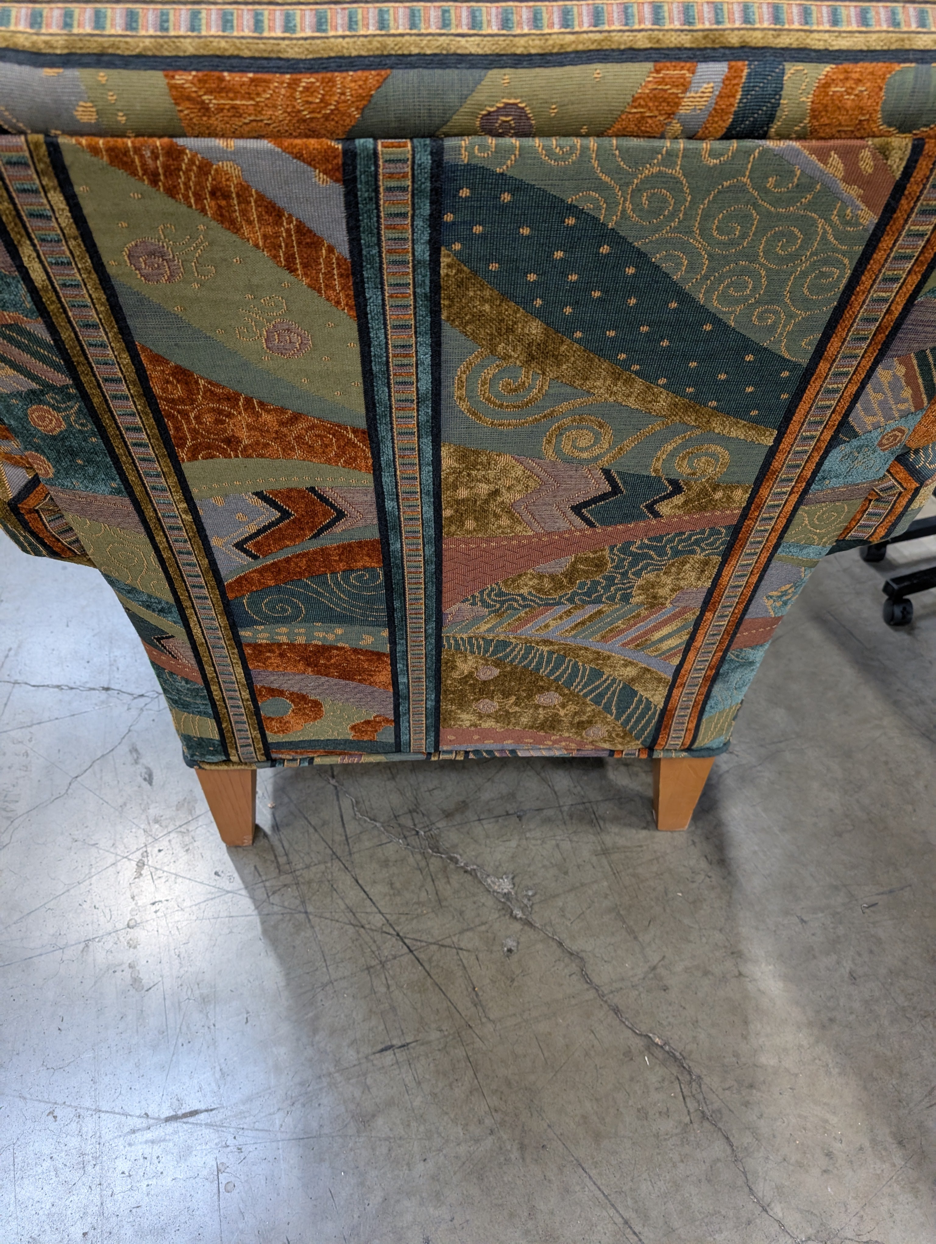 Vibrant Multi-Color Upholstered Armchair Cushion with Eclectic Pattern