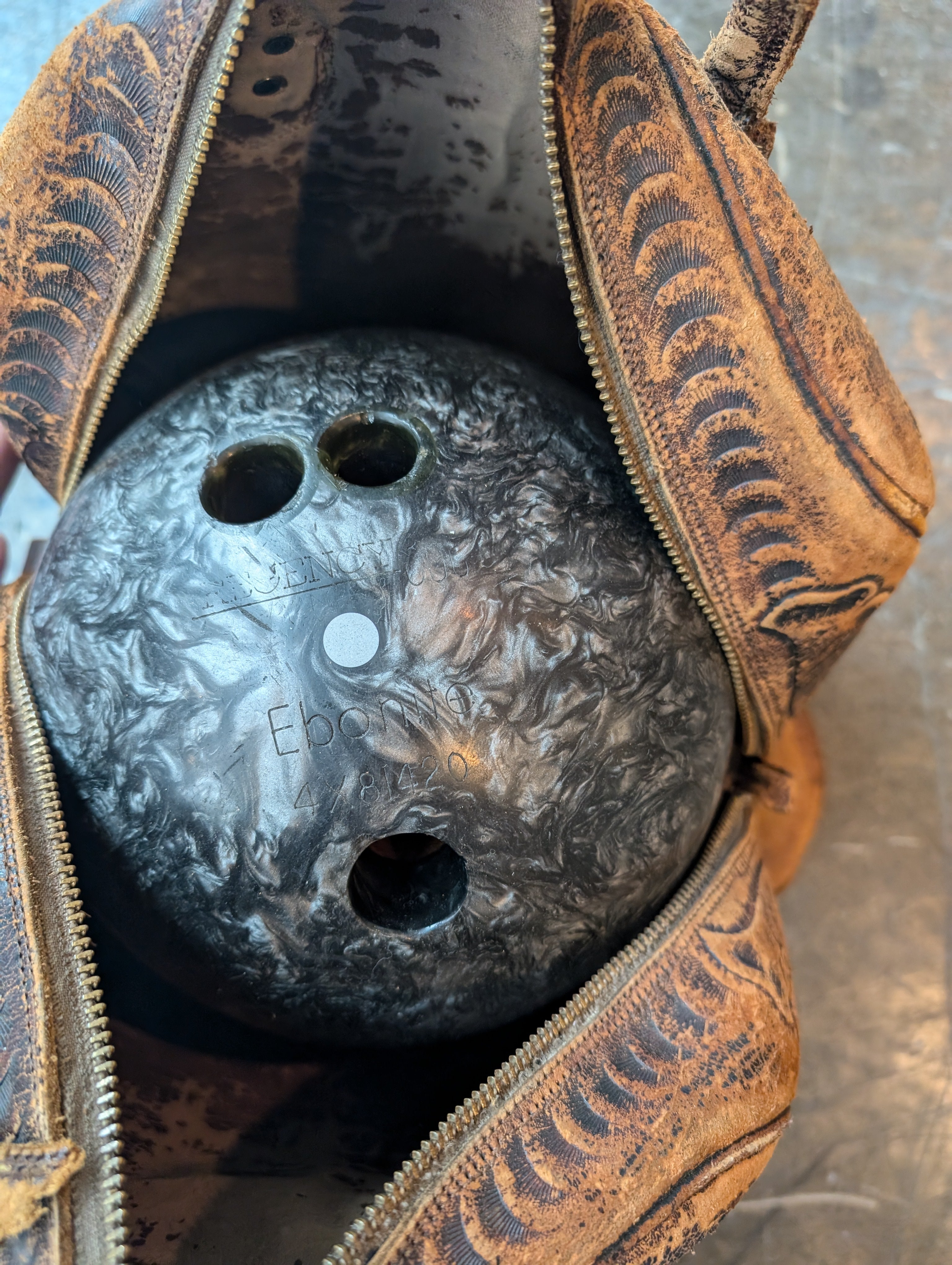 Ebonite Bowling Ball with Textured Brown Carry Bag