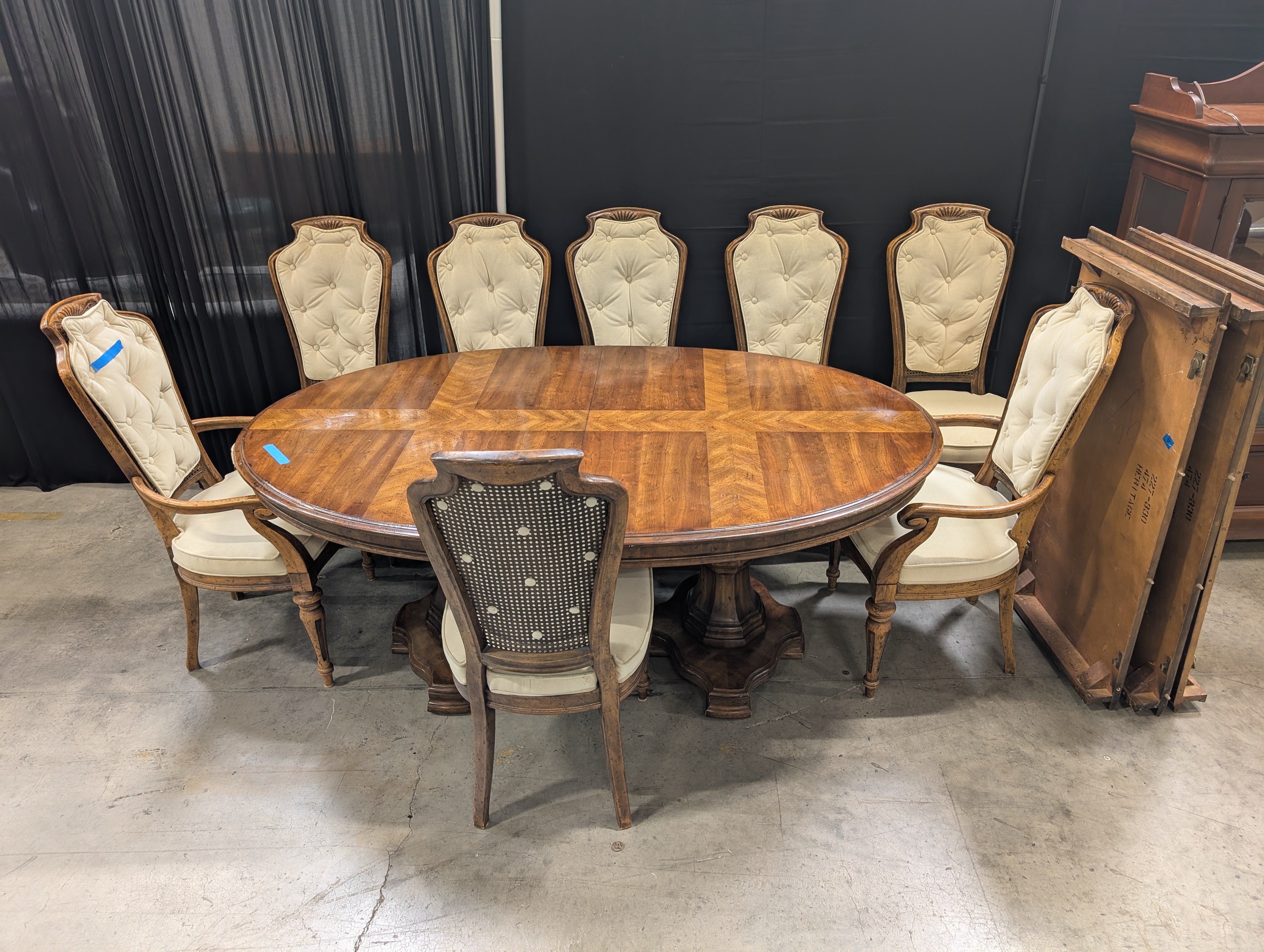 Traditional Carved Wood Dining Table with Eight Upholstered Chairs and Three Leafs