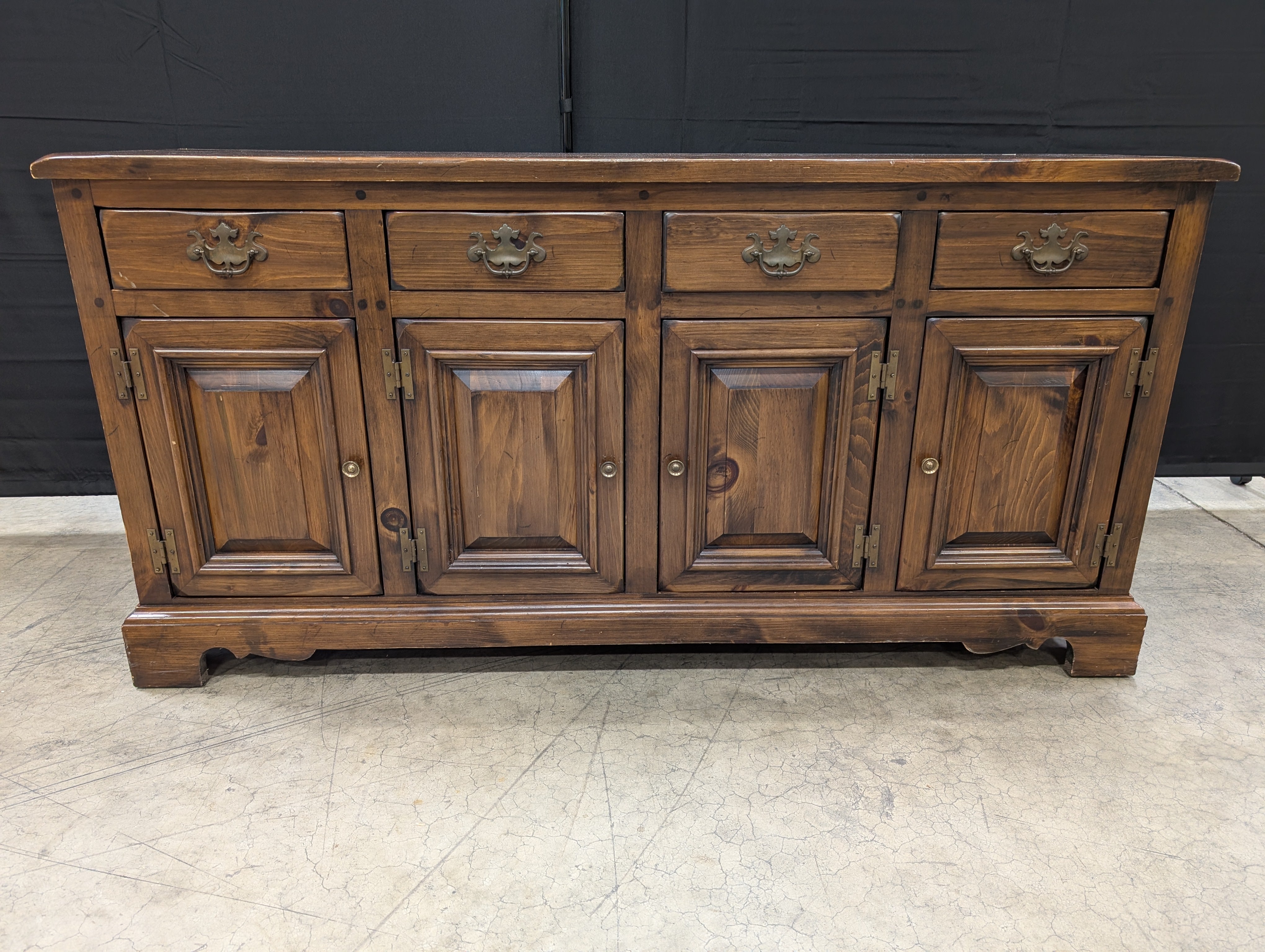 Rustic Dark Stained Wood Sideboard with Ornate Hardware