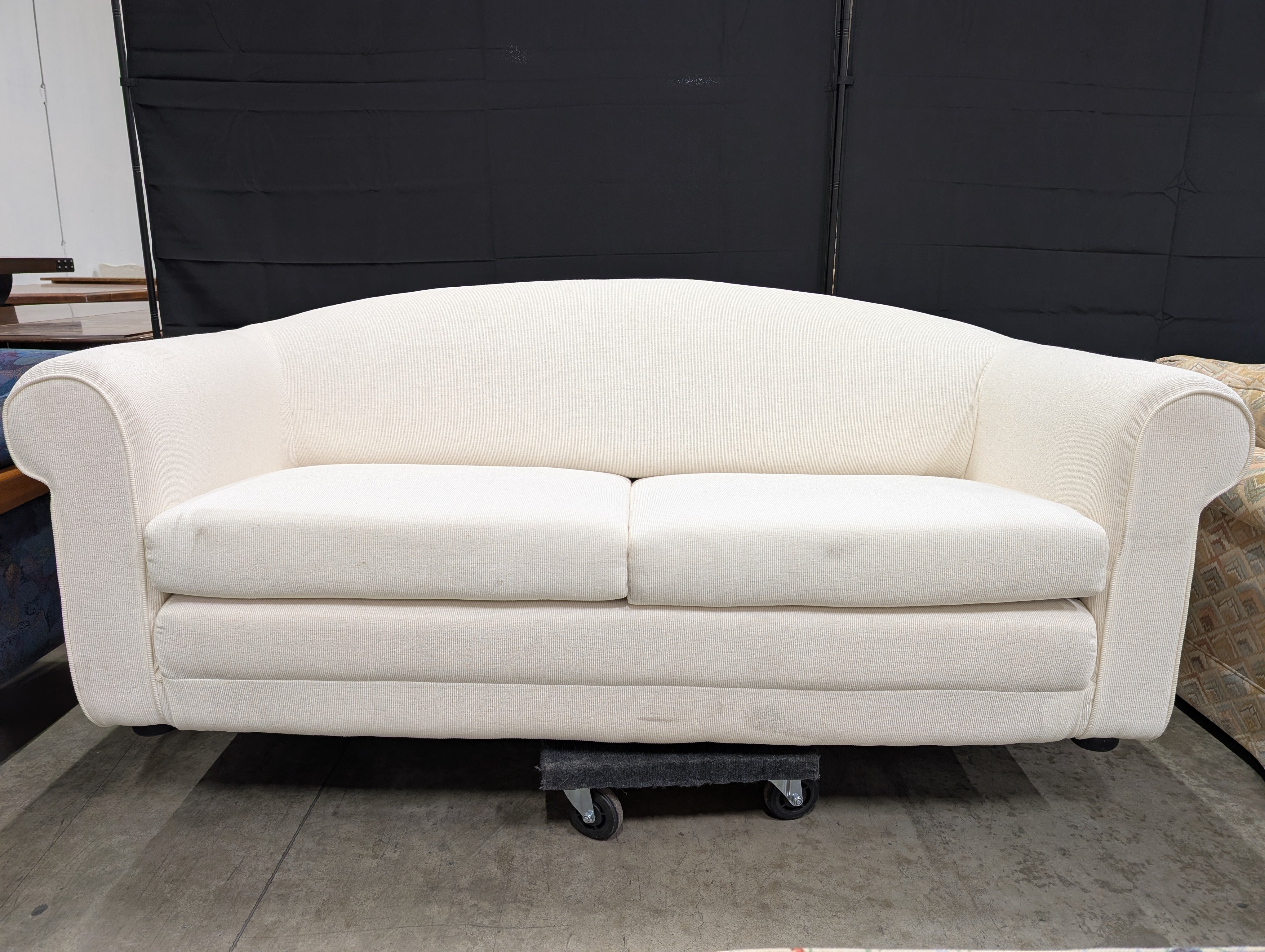 Cream-Colored Two-Seater Sofa