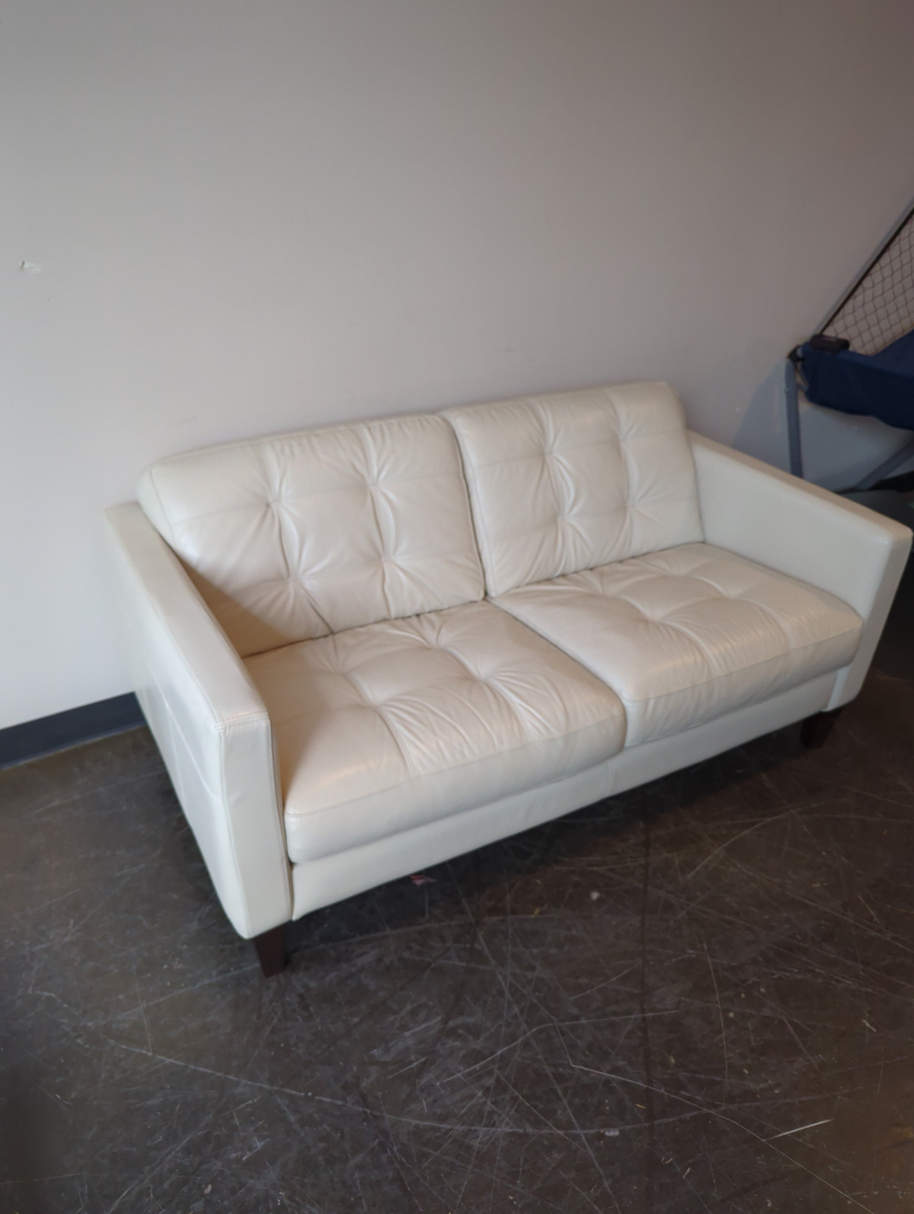 Chateau d'Ax Cream Leather Two-Seater Sofa with Tufted Cushions