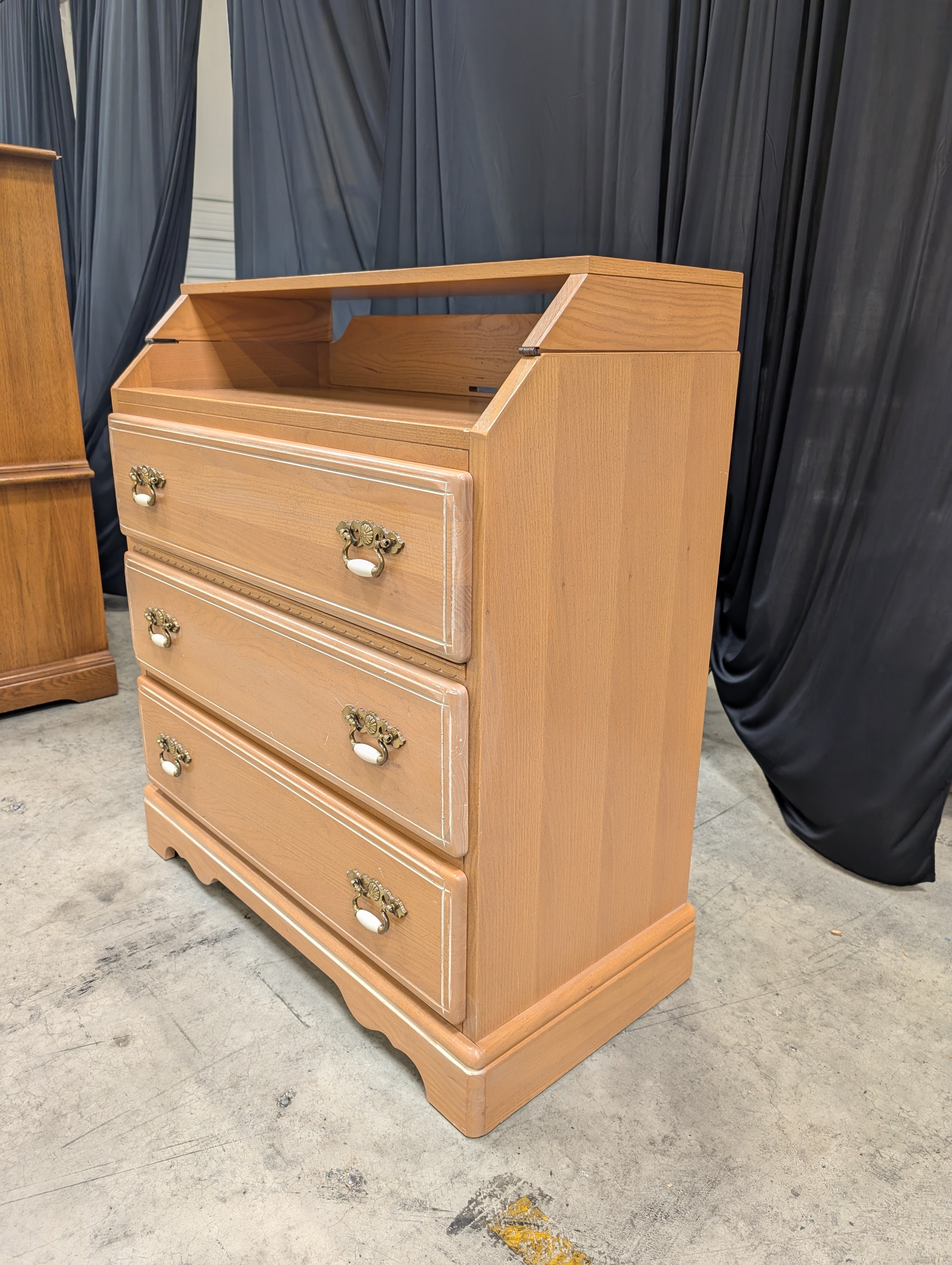 Light Brown Wood Dresser with Ornate Hardware