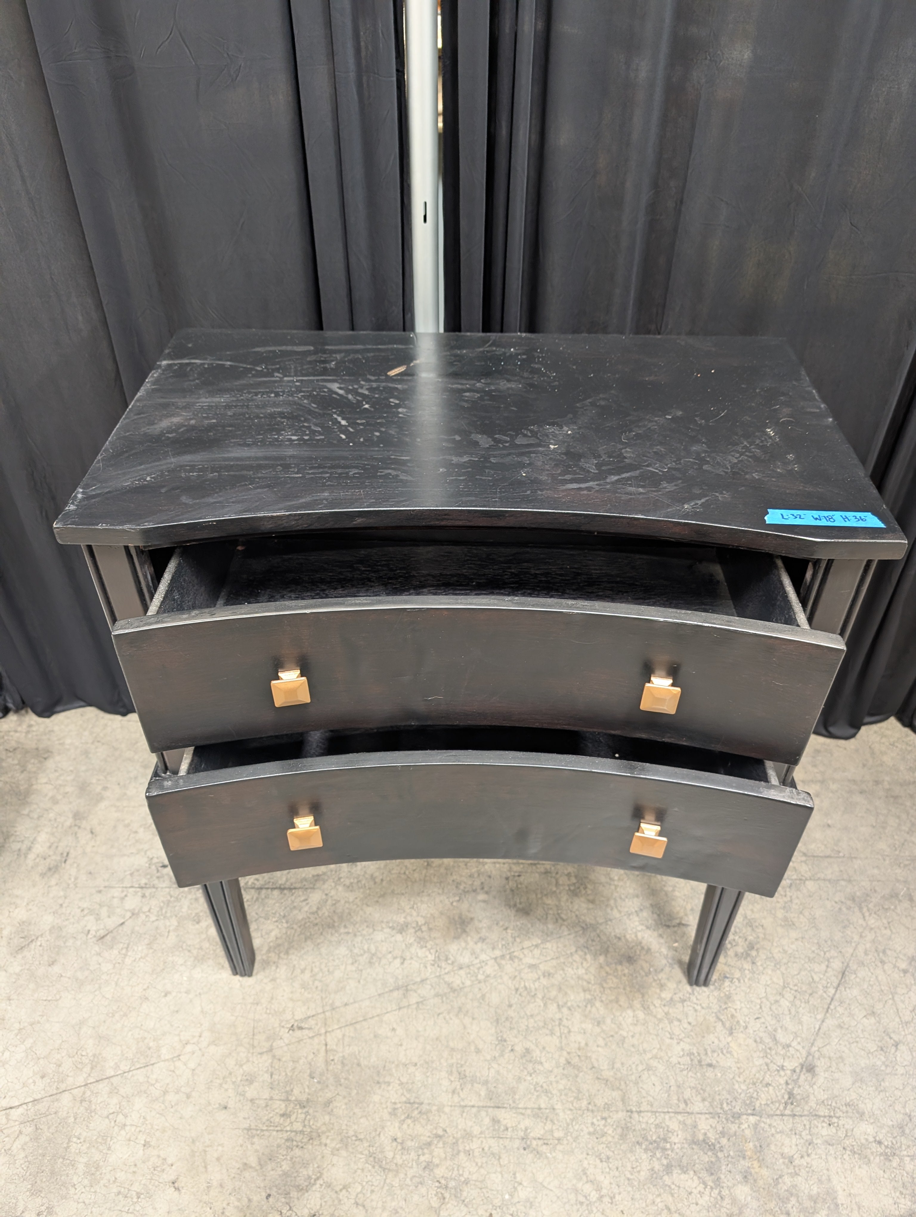 Black Curved Wood Nightstand with Gold Knobs
