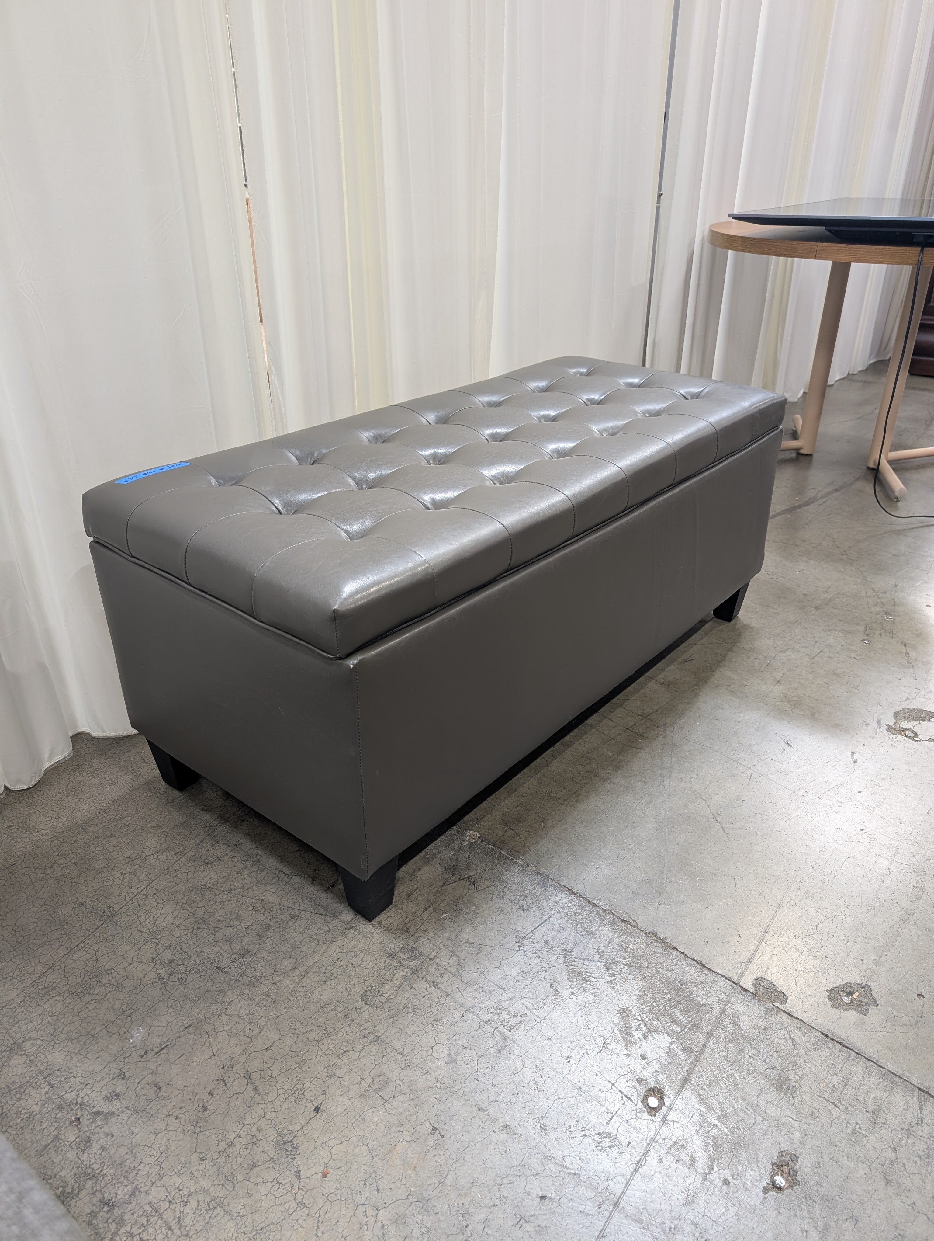 Charcoal Tufted Storage Ottoman in Faux Leather