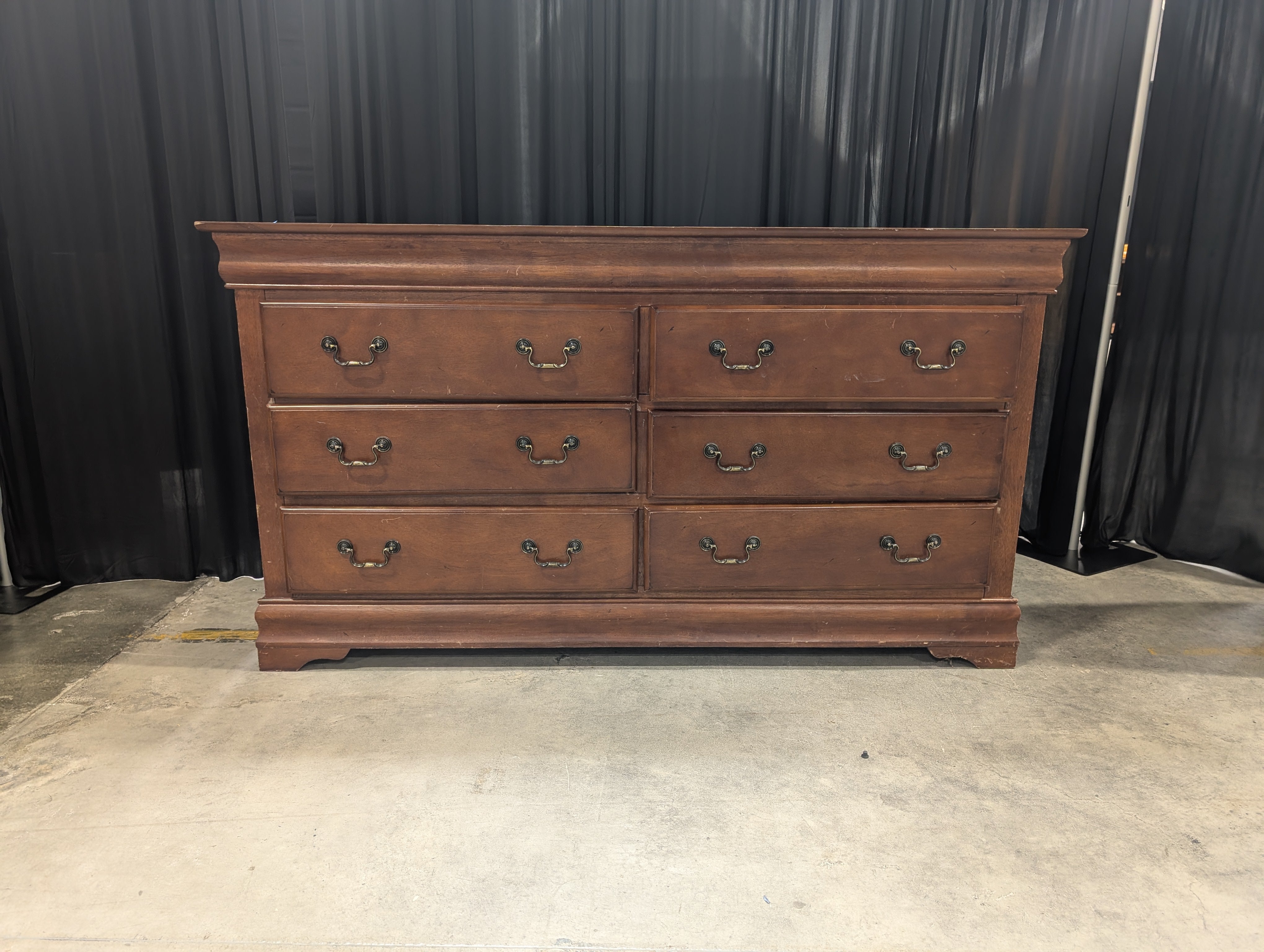 Dark Wood Six-Drawer Dresser with Ornate Hardware