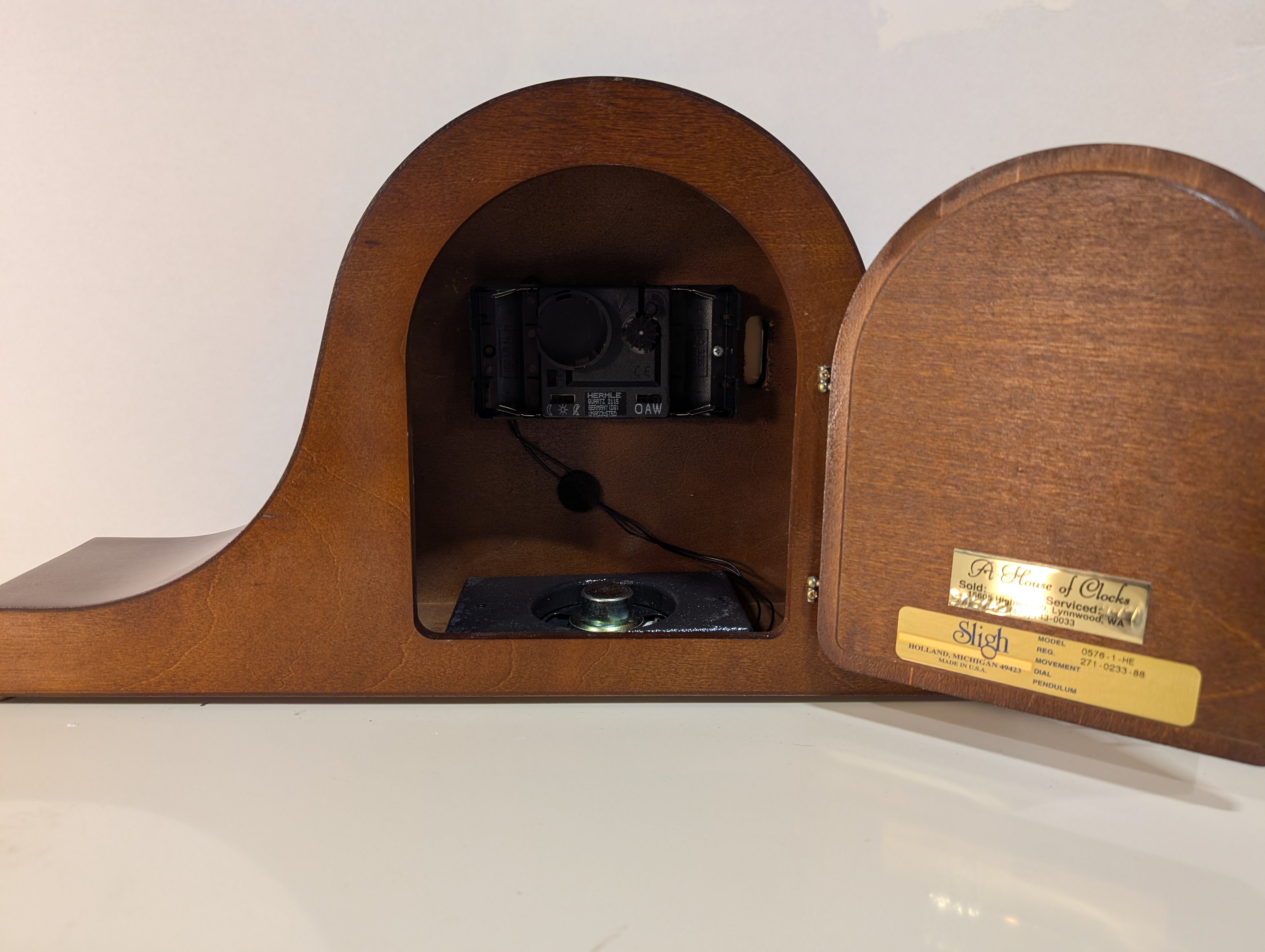Curved Dark Wood Table Clock with Brass Tone Bezel