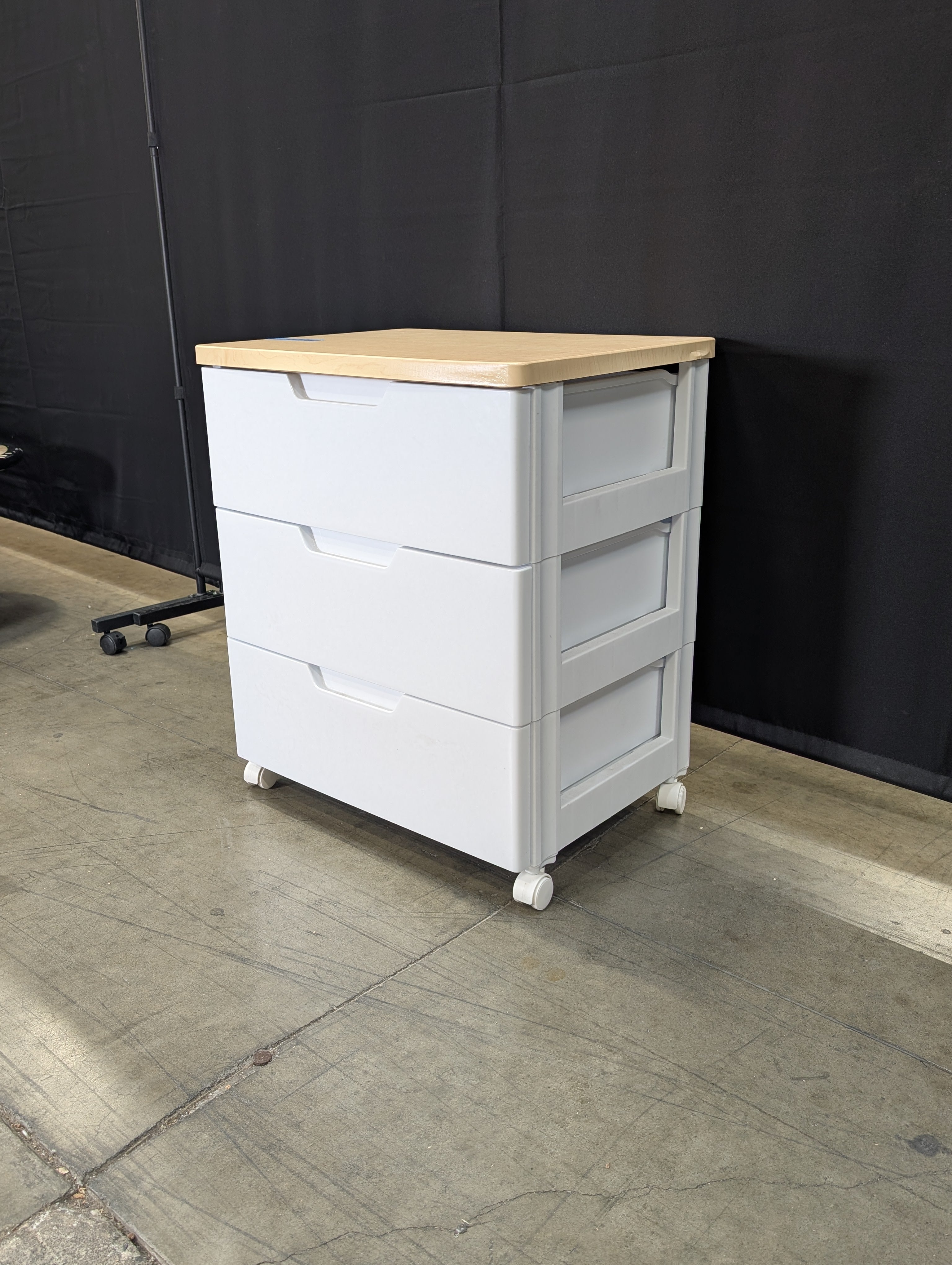 Contemporary White Three-Drawer Chest with Light Wood Surface