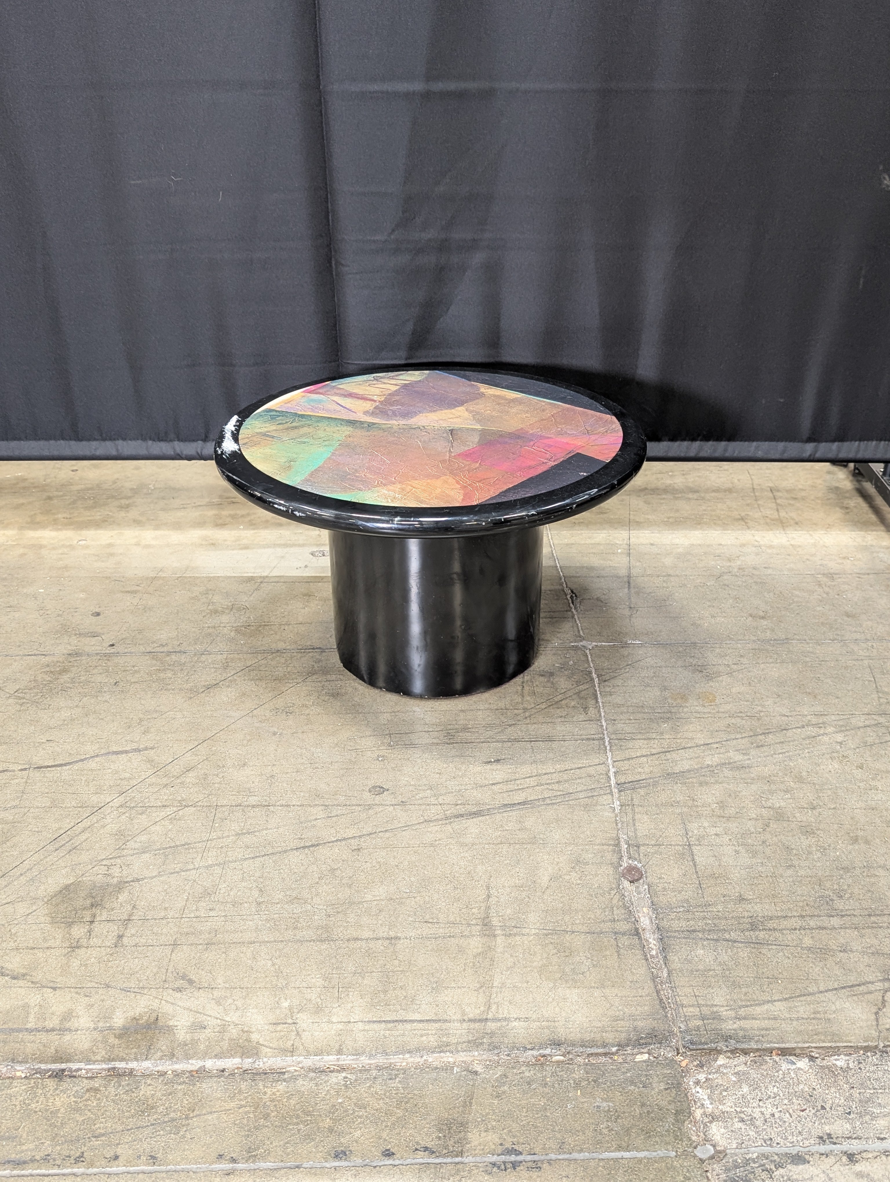 Striking Round Pedestal Coffee Table with Iridescent Top