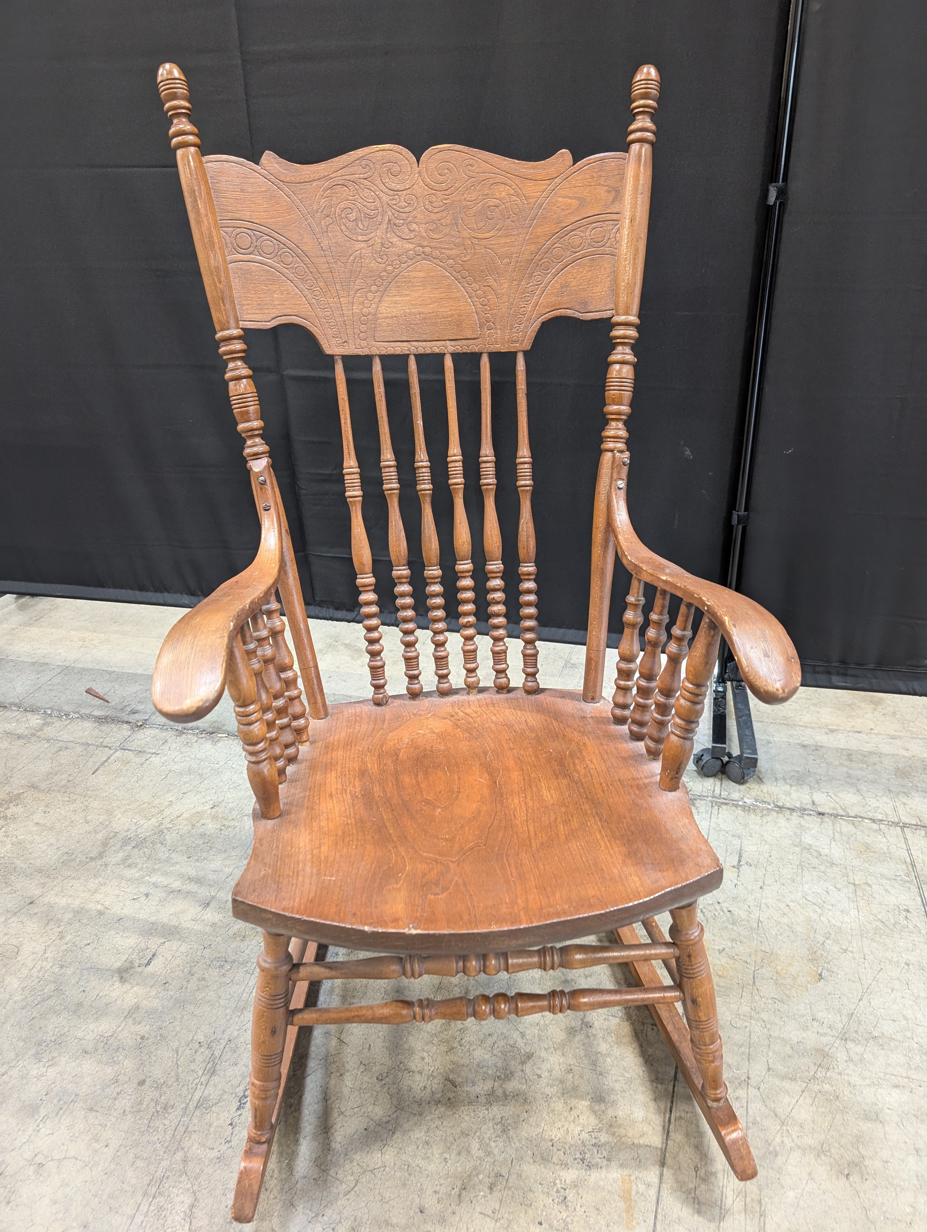 Classic Hardwood Rocking Chair with Ornate Carved Backrest
