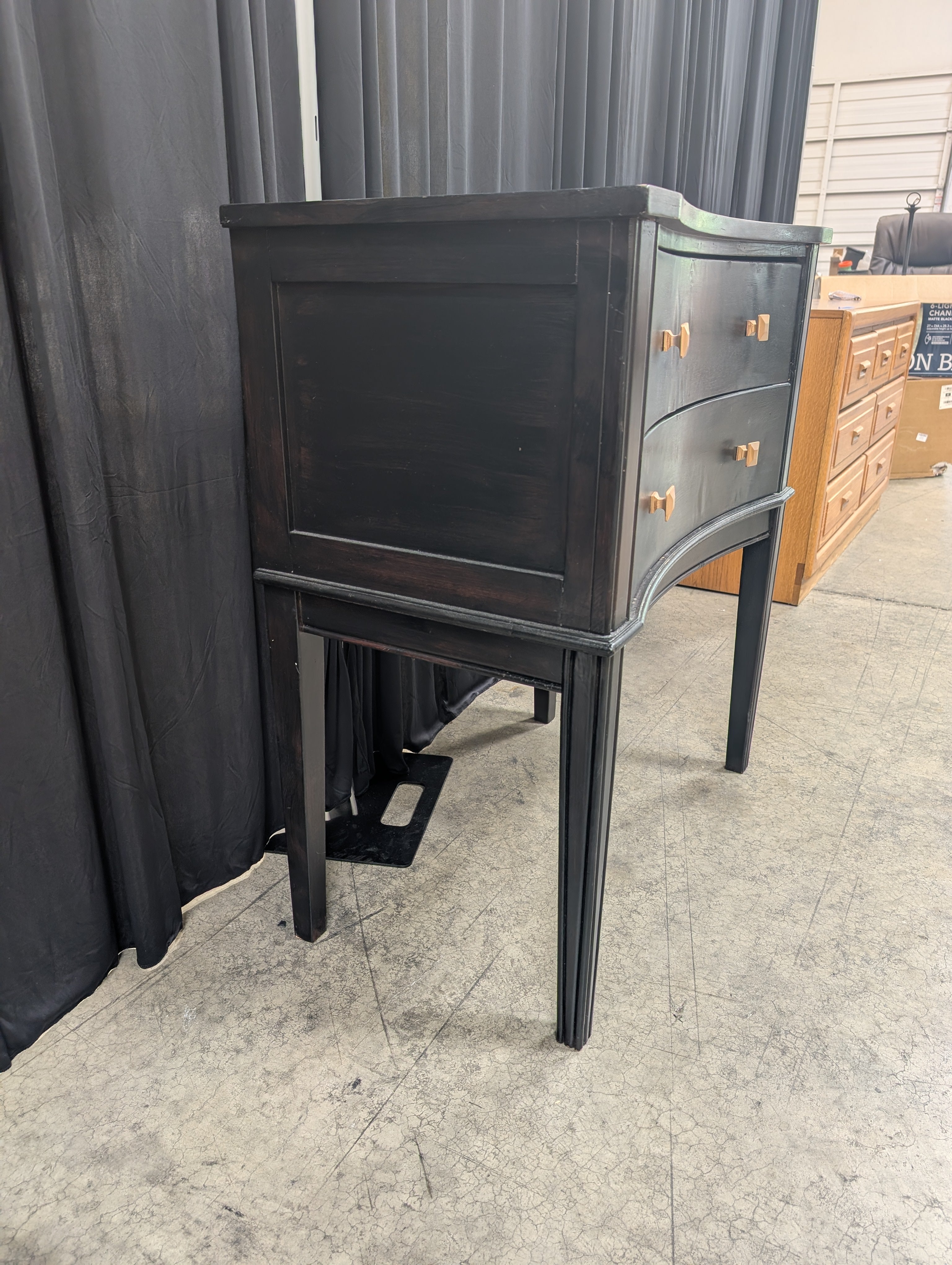 Black Curved Wood Nightstand with Gold Knobs
