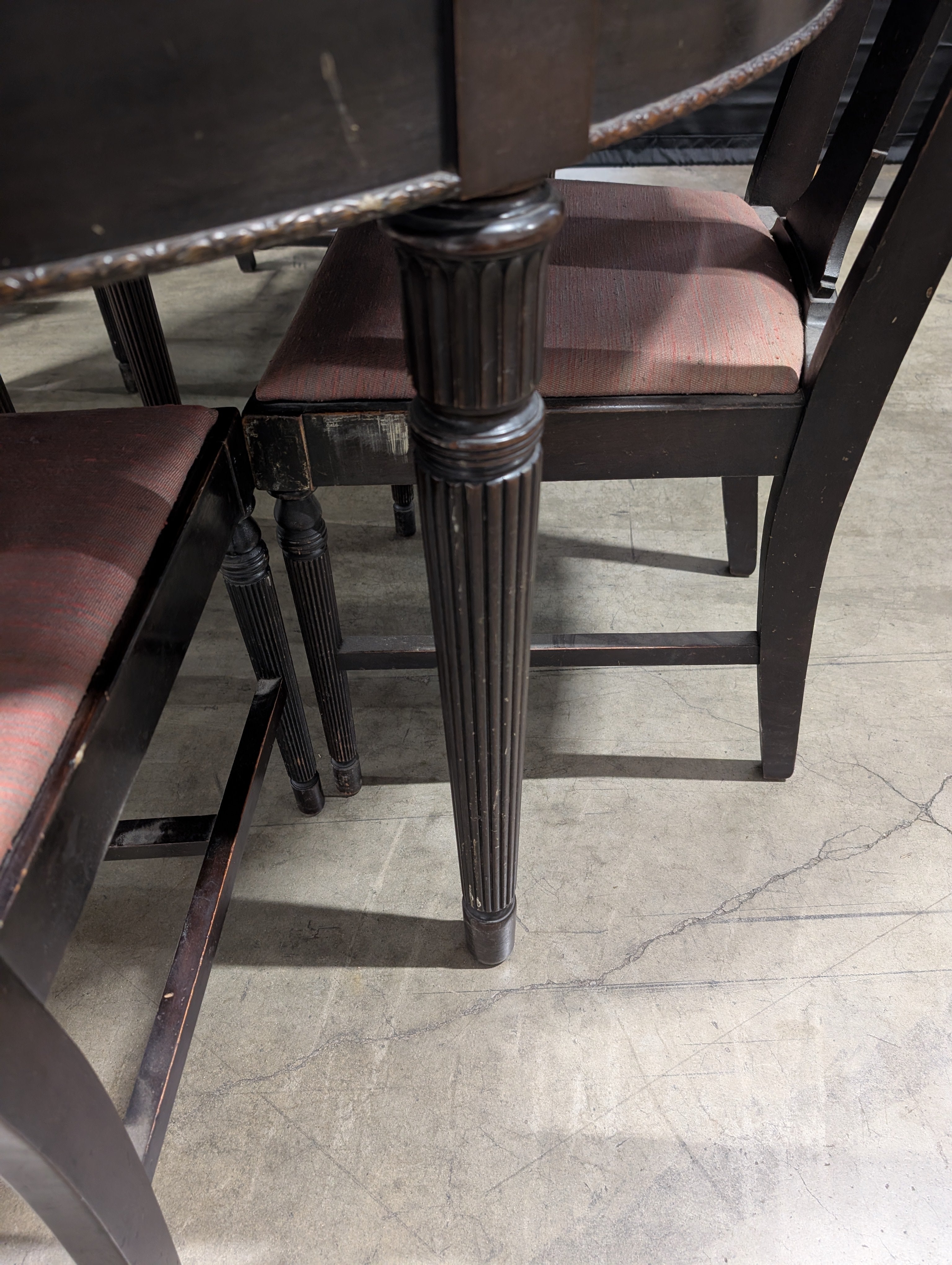 Dark Wood Oval Extendable Dining Table with Seven matching Chairs