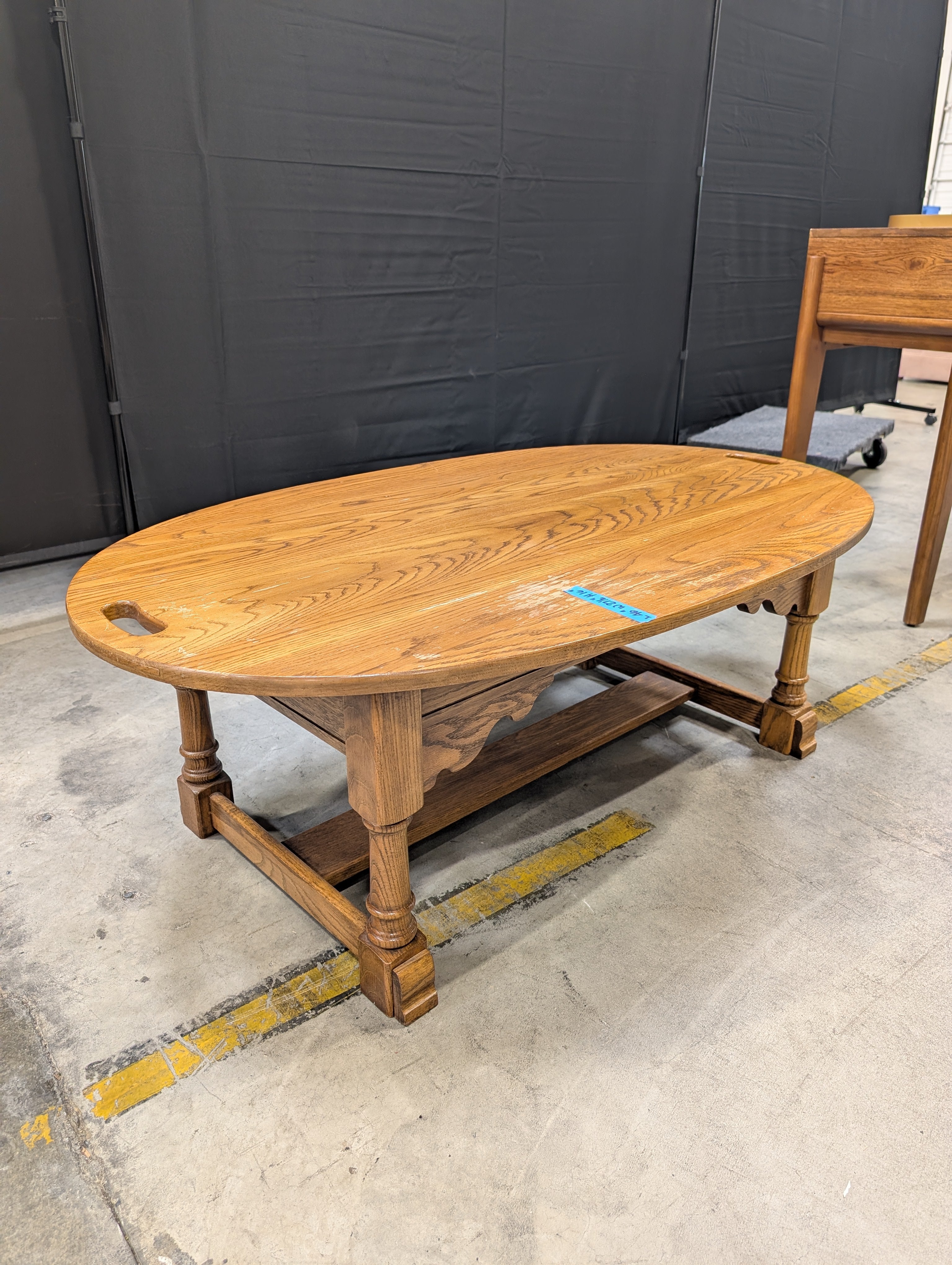 Oval Light Brown Wood Coffee Table with Cut-Out Handles