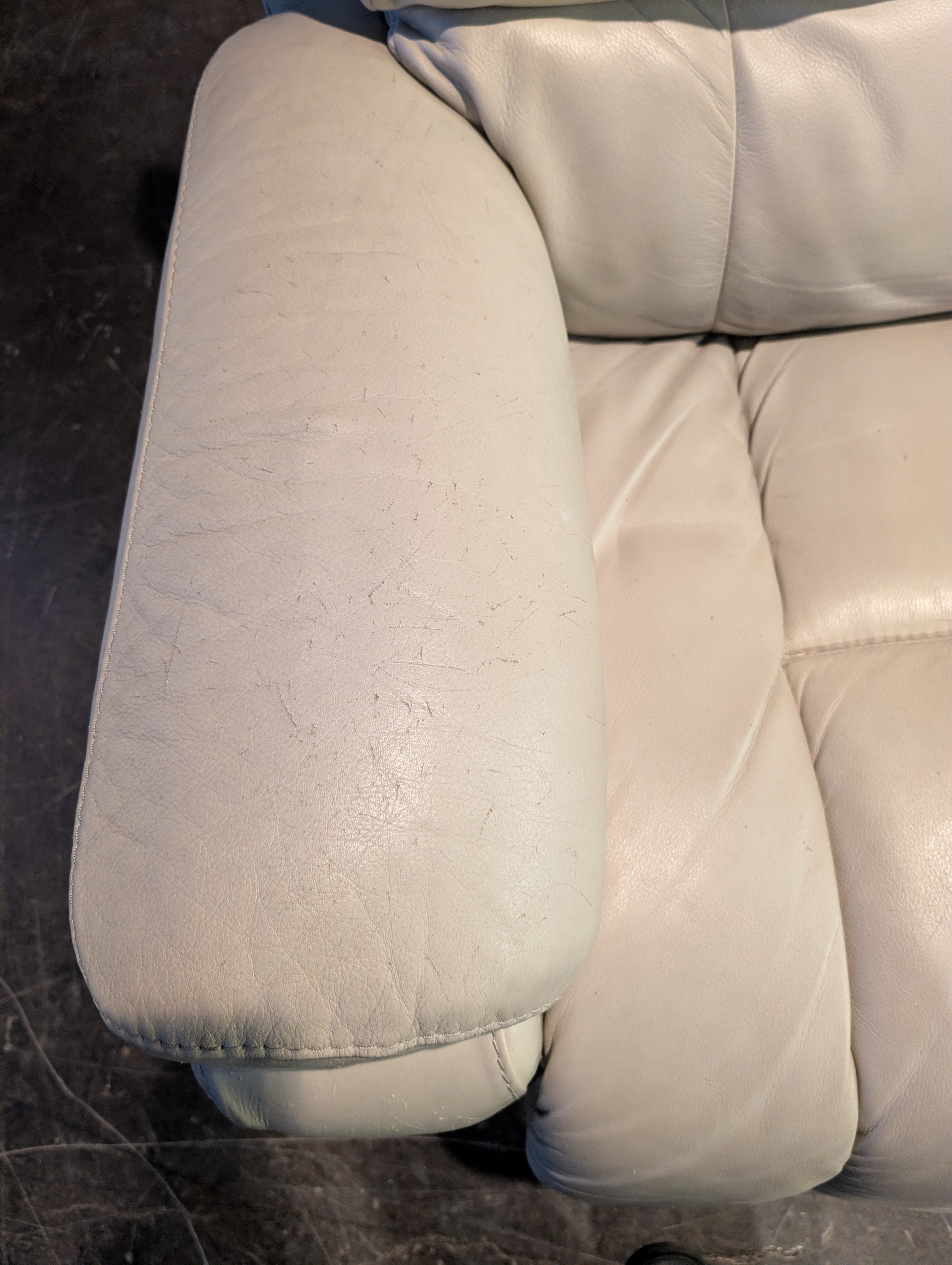 Cream Upholstered Two-Seater Reclining Sofa