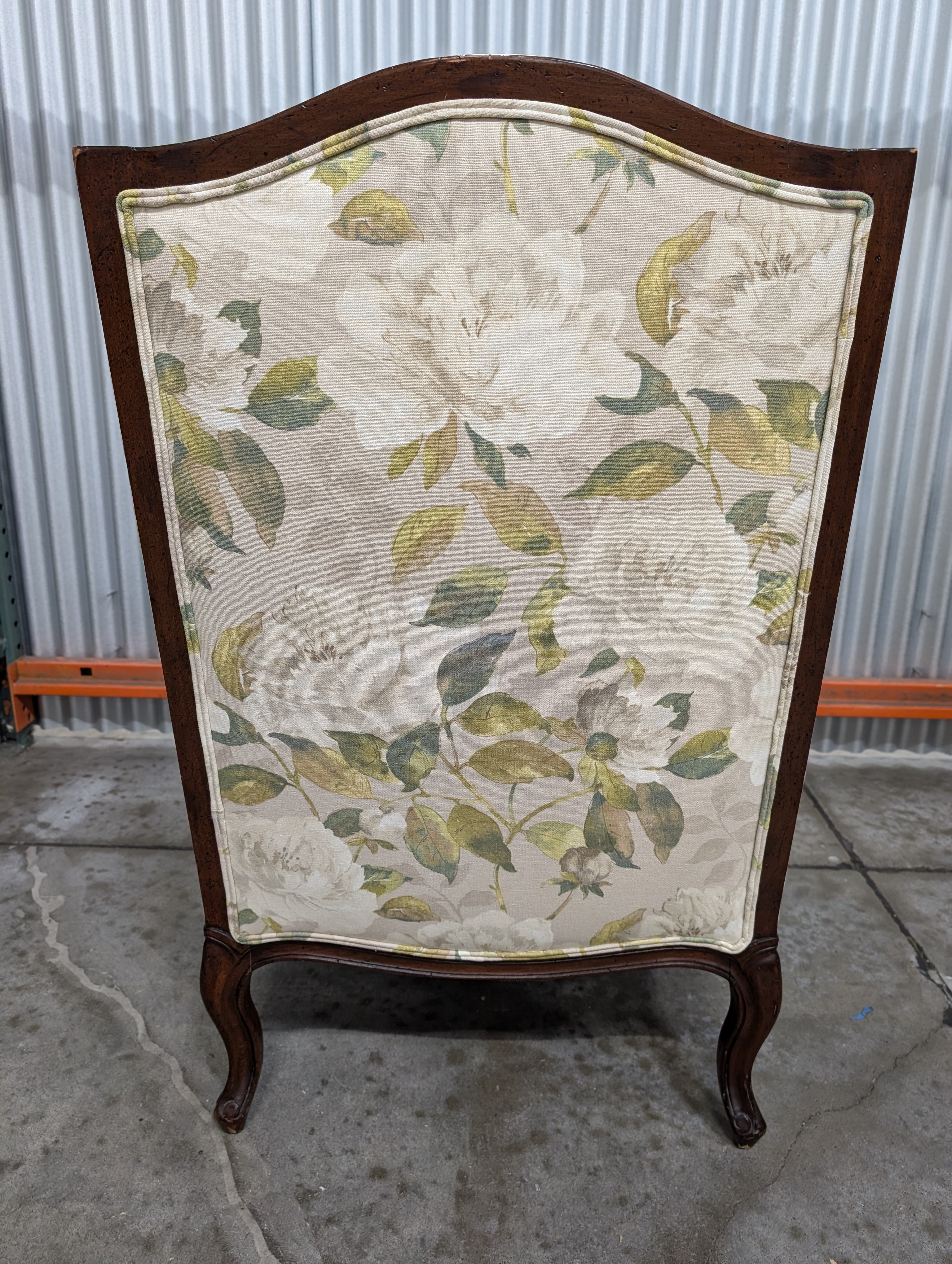 Vintage Wingback Armchair with Floral Upholstery and Carved Wood Frame