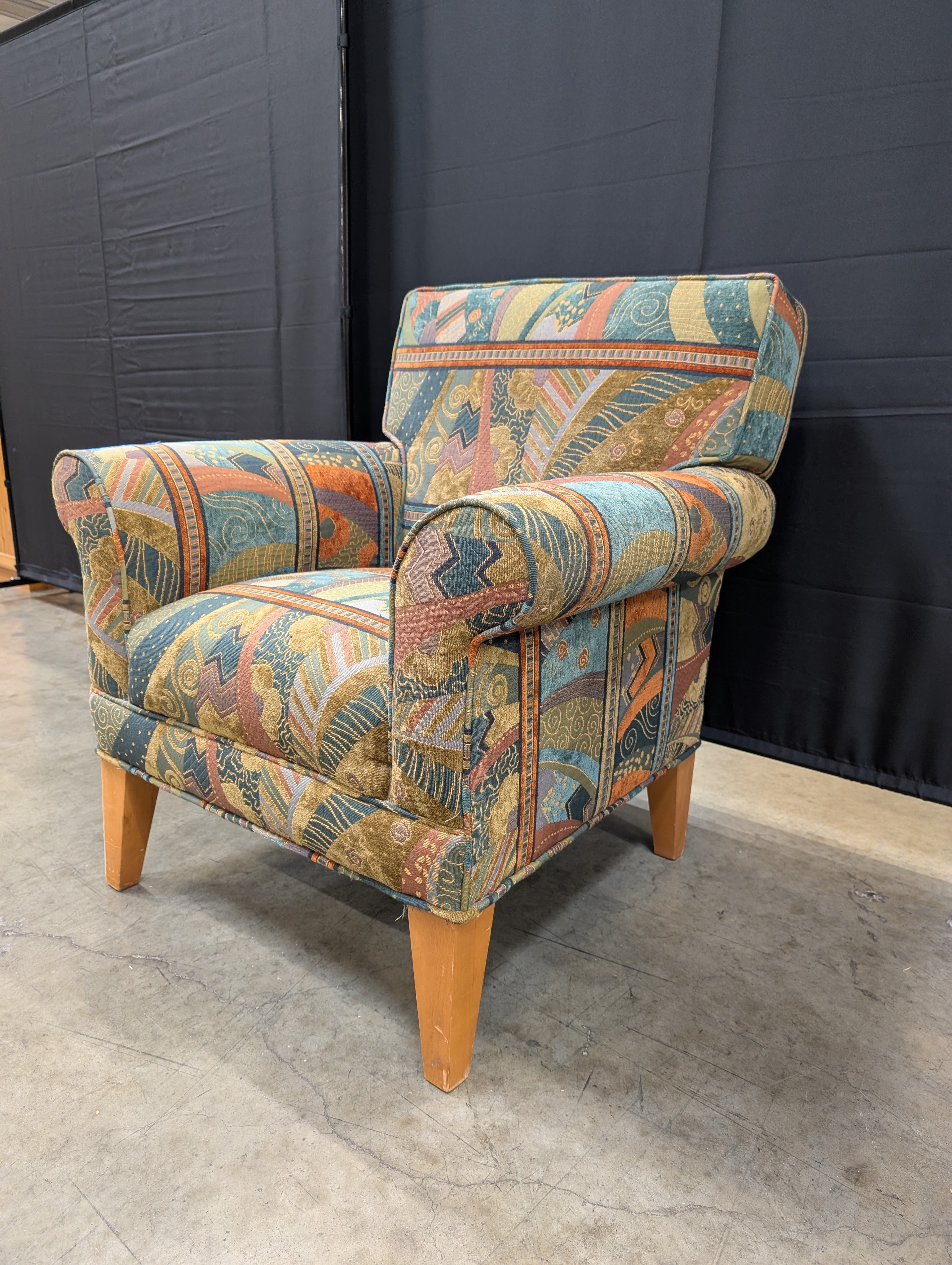 Vibrant Multi-Color Upholstered Armchair Cushion with Eclectic Pattern