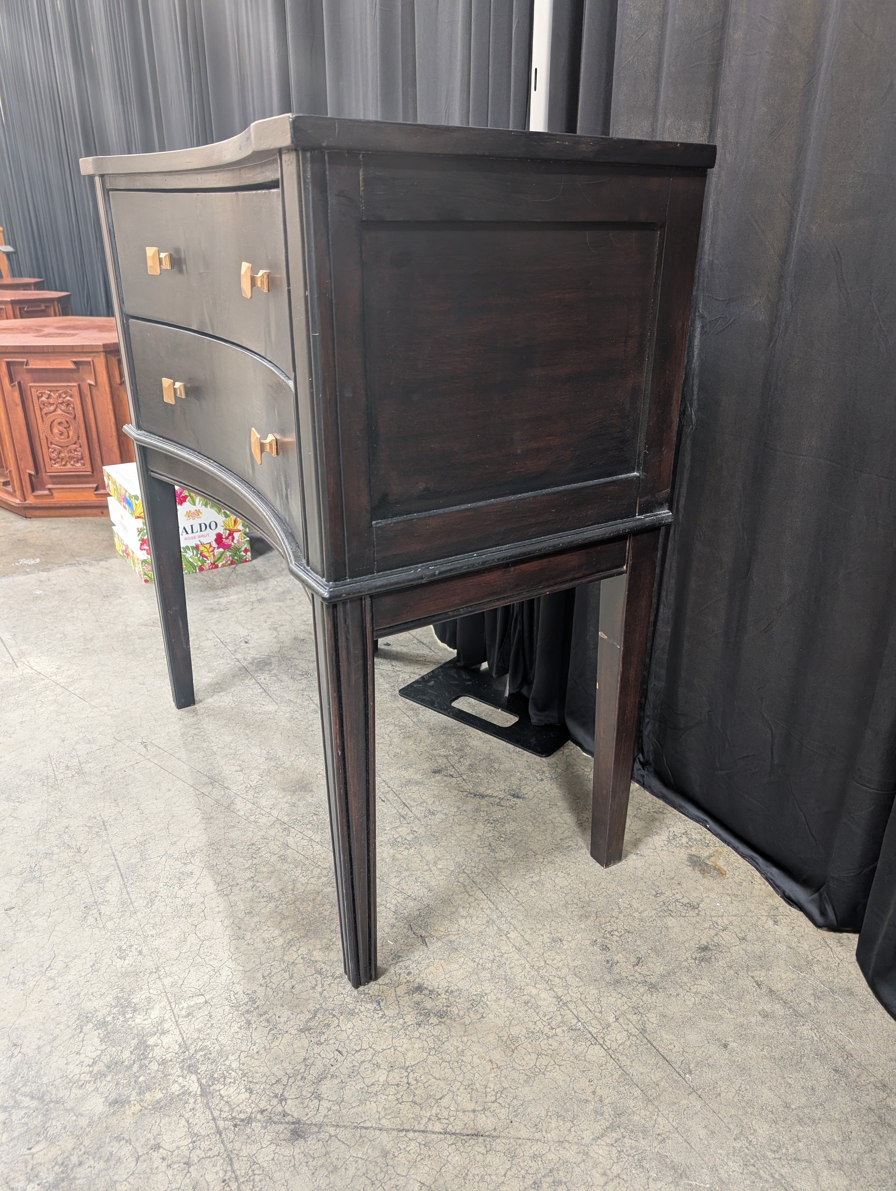 Black Curved Wood Nightstand with Gold Knobs