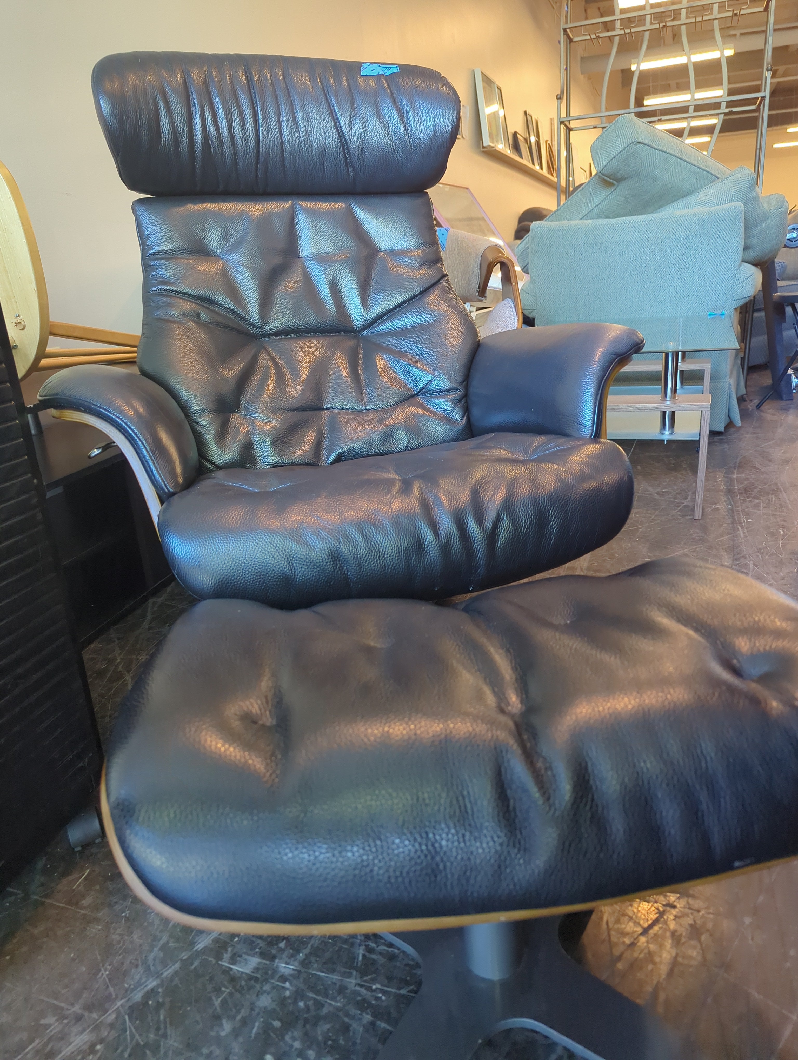 Luxurious Black Leather Recliner and Ottoman Set