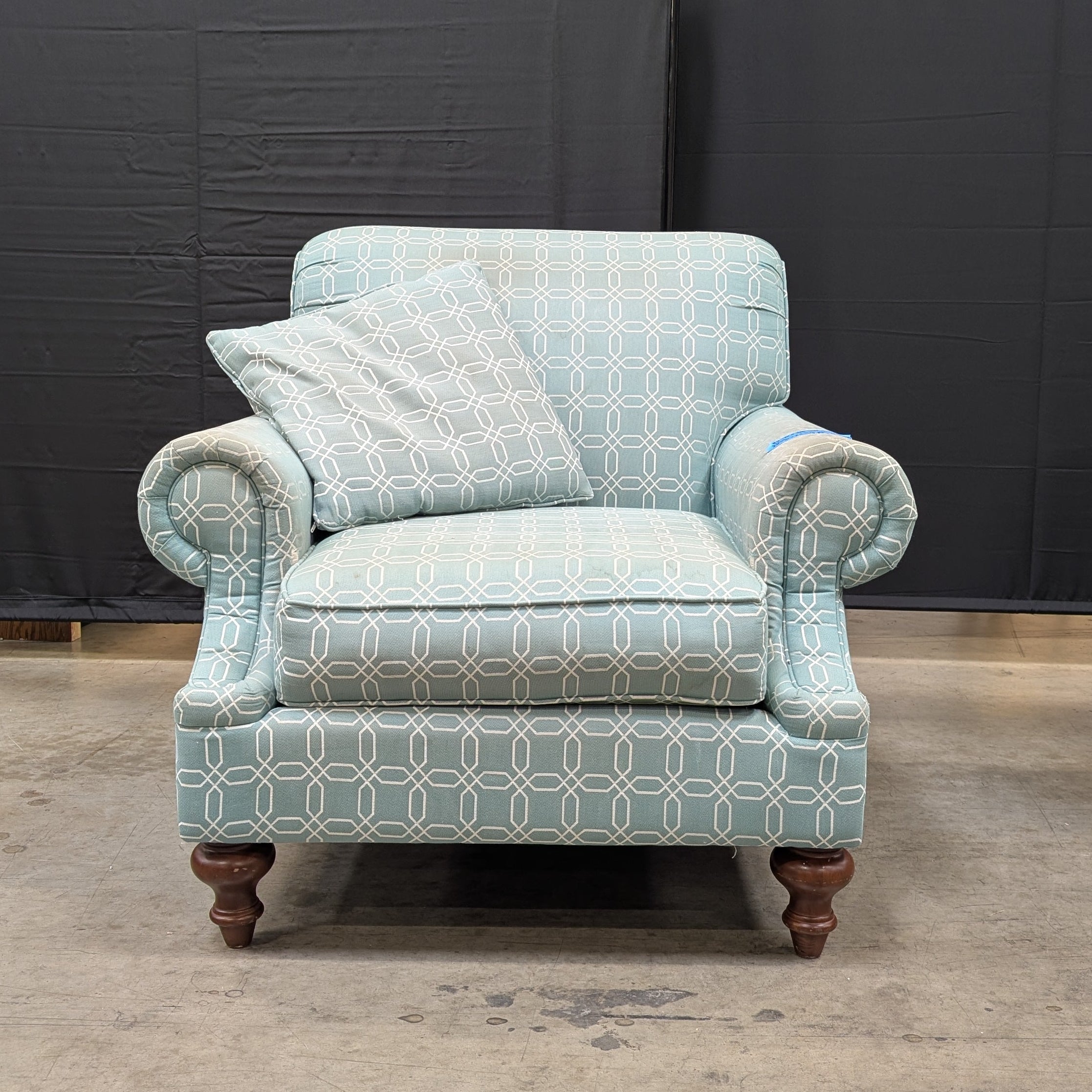 Comfortable Armchair with Green Wavy Pattern Slipcover