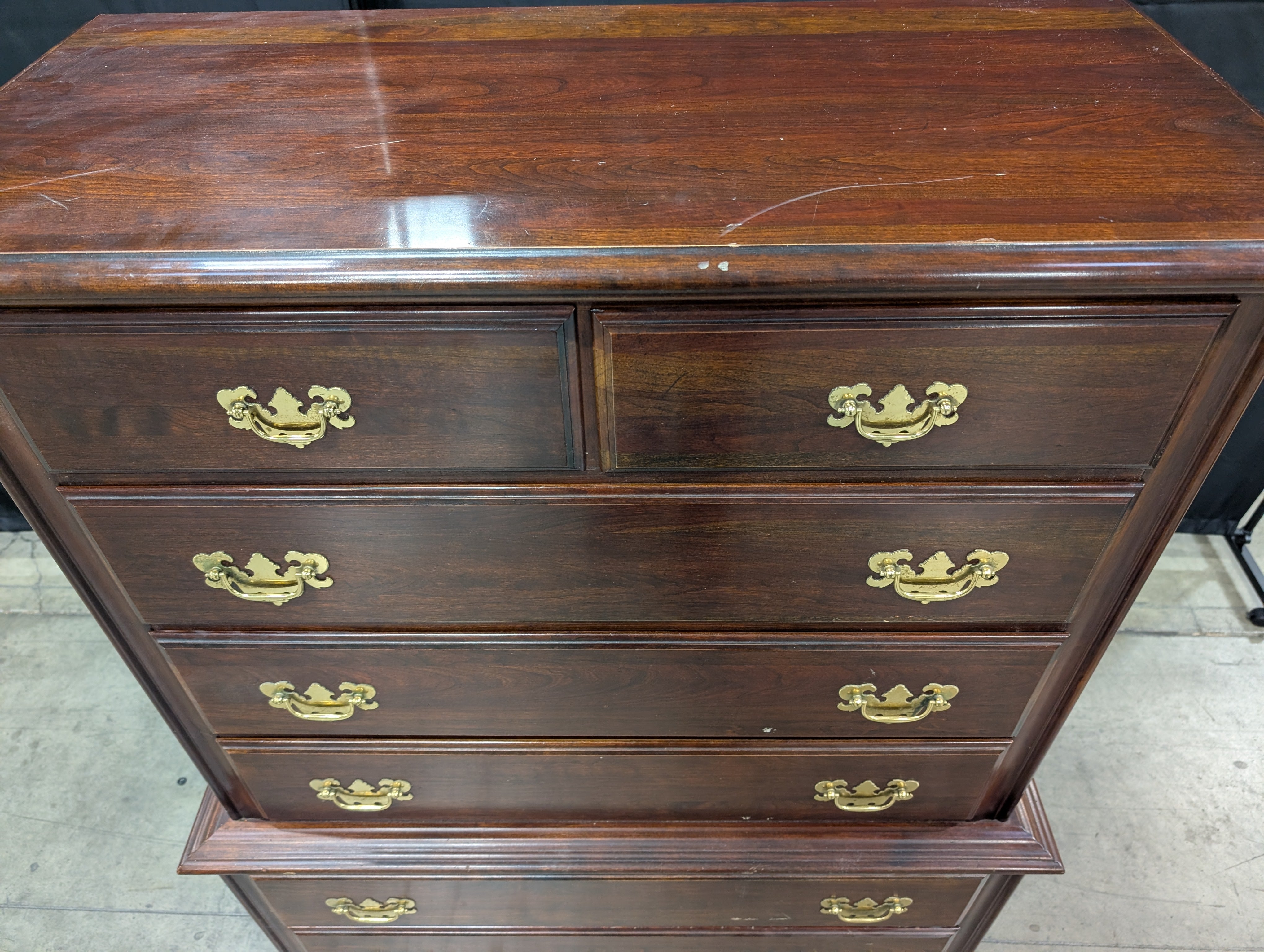 Traditional Dark Wood Chest of Drawers with Ornate Brass Pulls