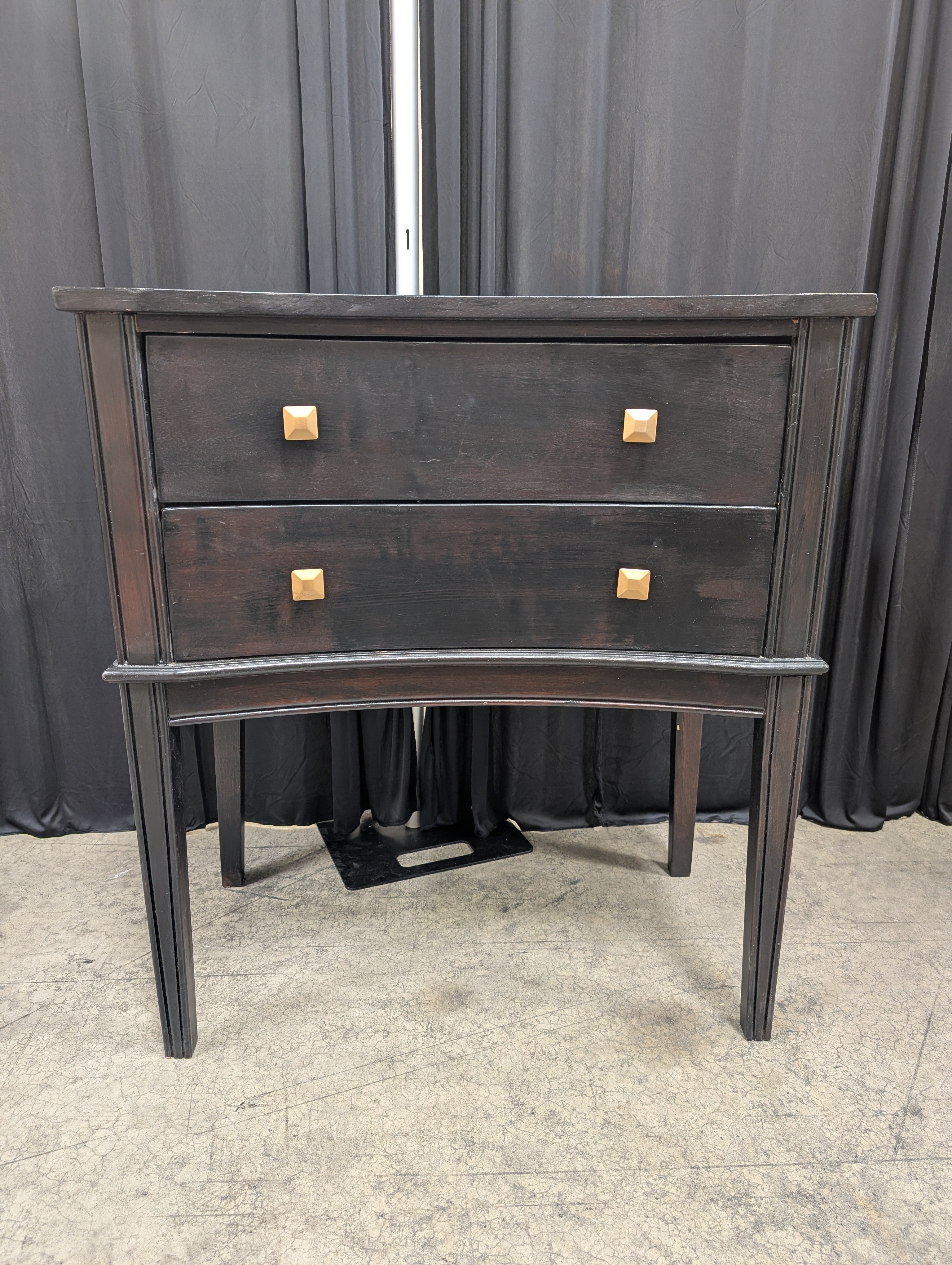 Black Curved Wood Nightstand with Gold Knobs