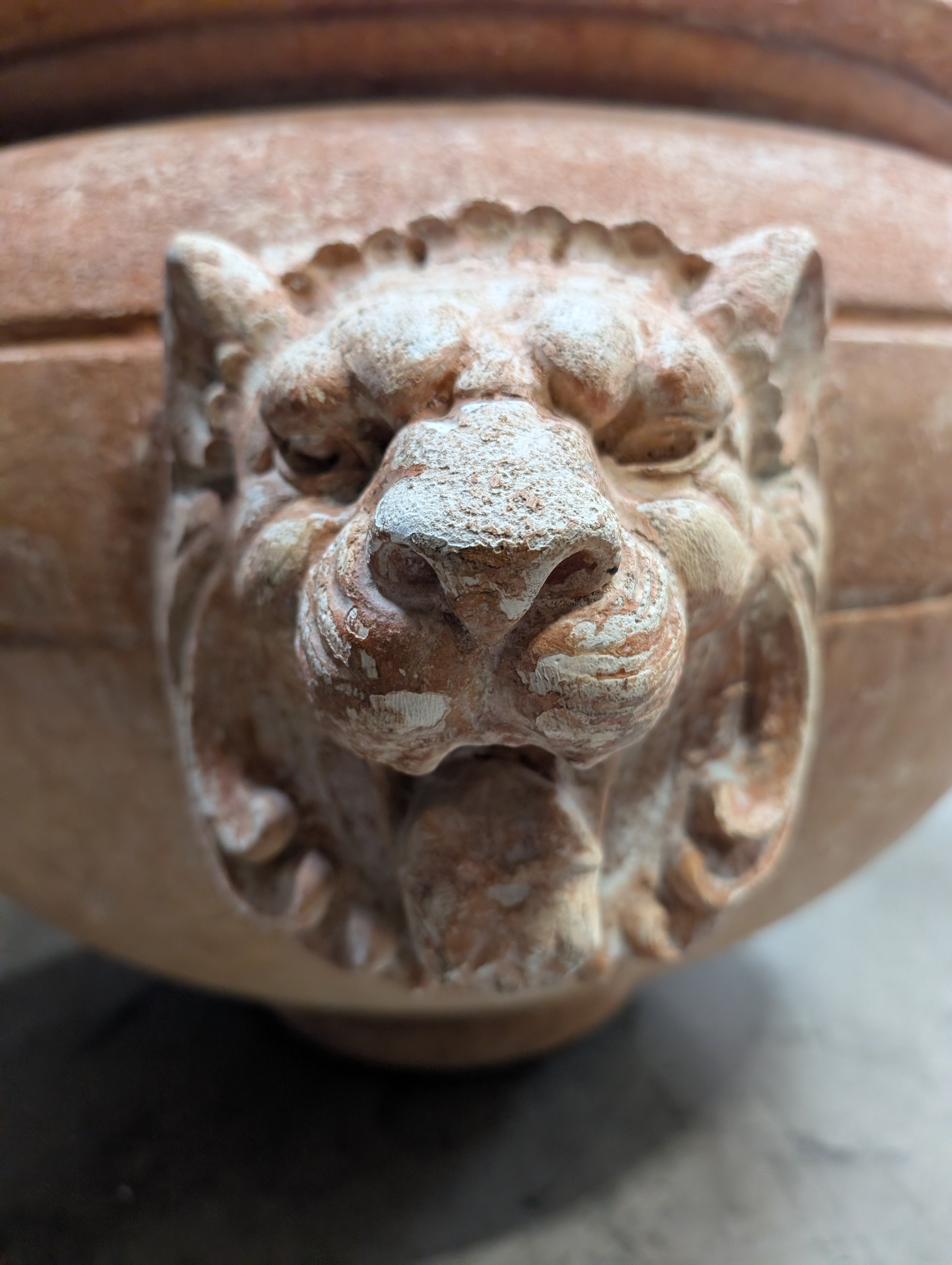 Ornate Terracotta-Style Planter with Lion Head Accents