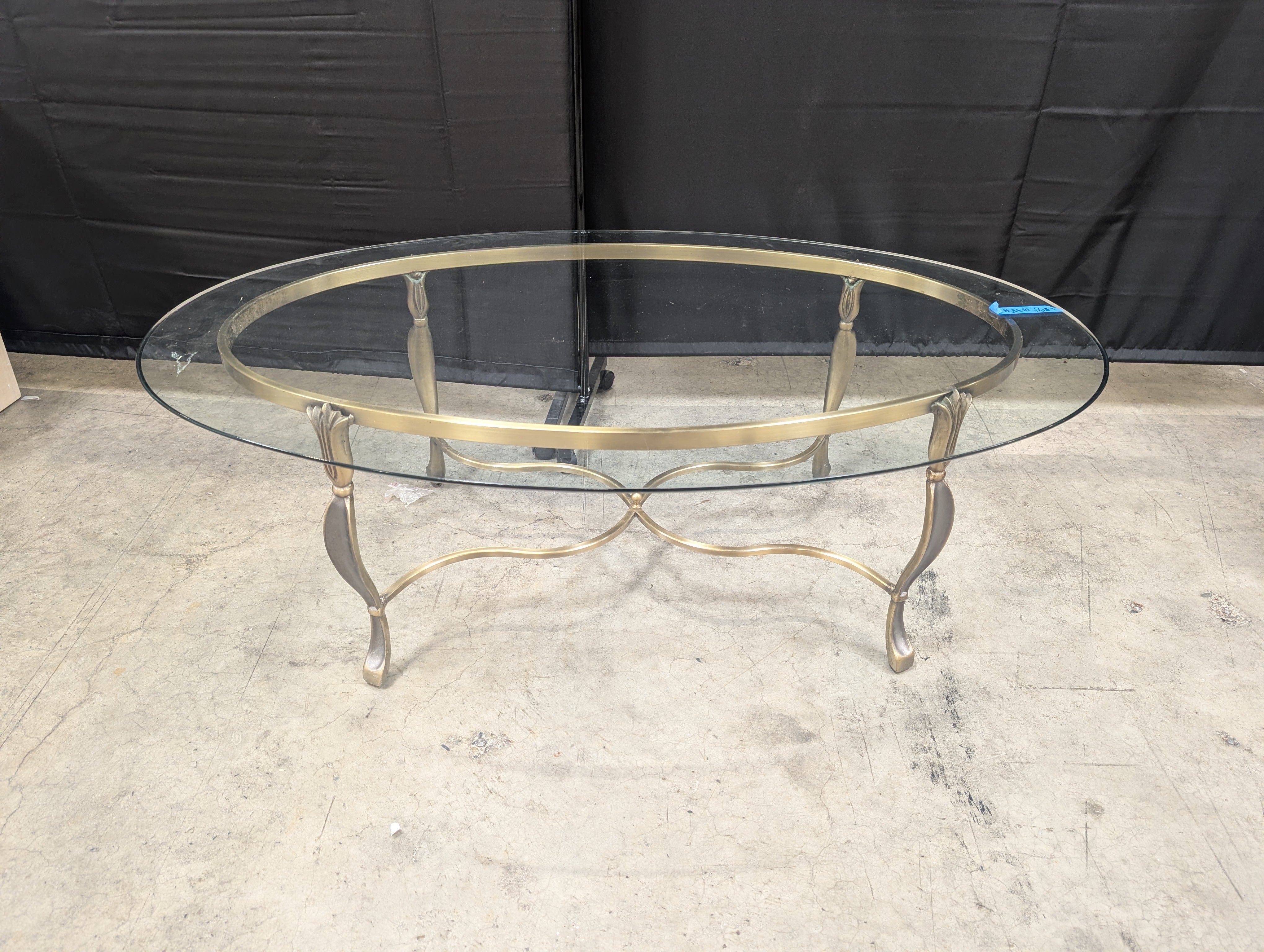 Ornate Brass-Toned Oval Coffee Table with Glass Top