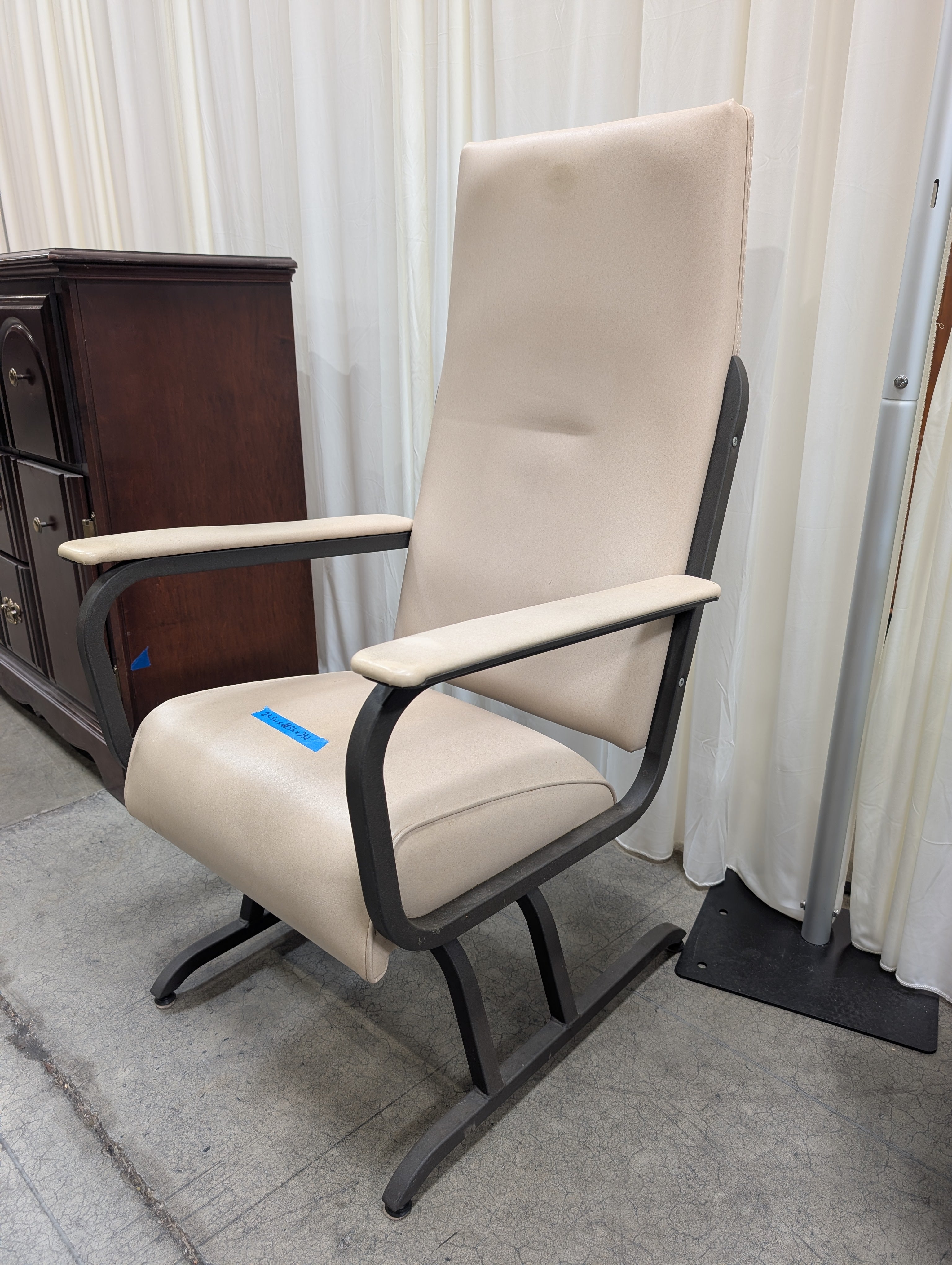 Cream Upholstered High-Back Chair with Metal Frame