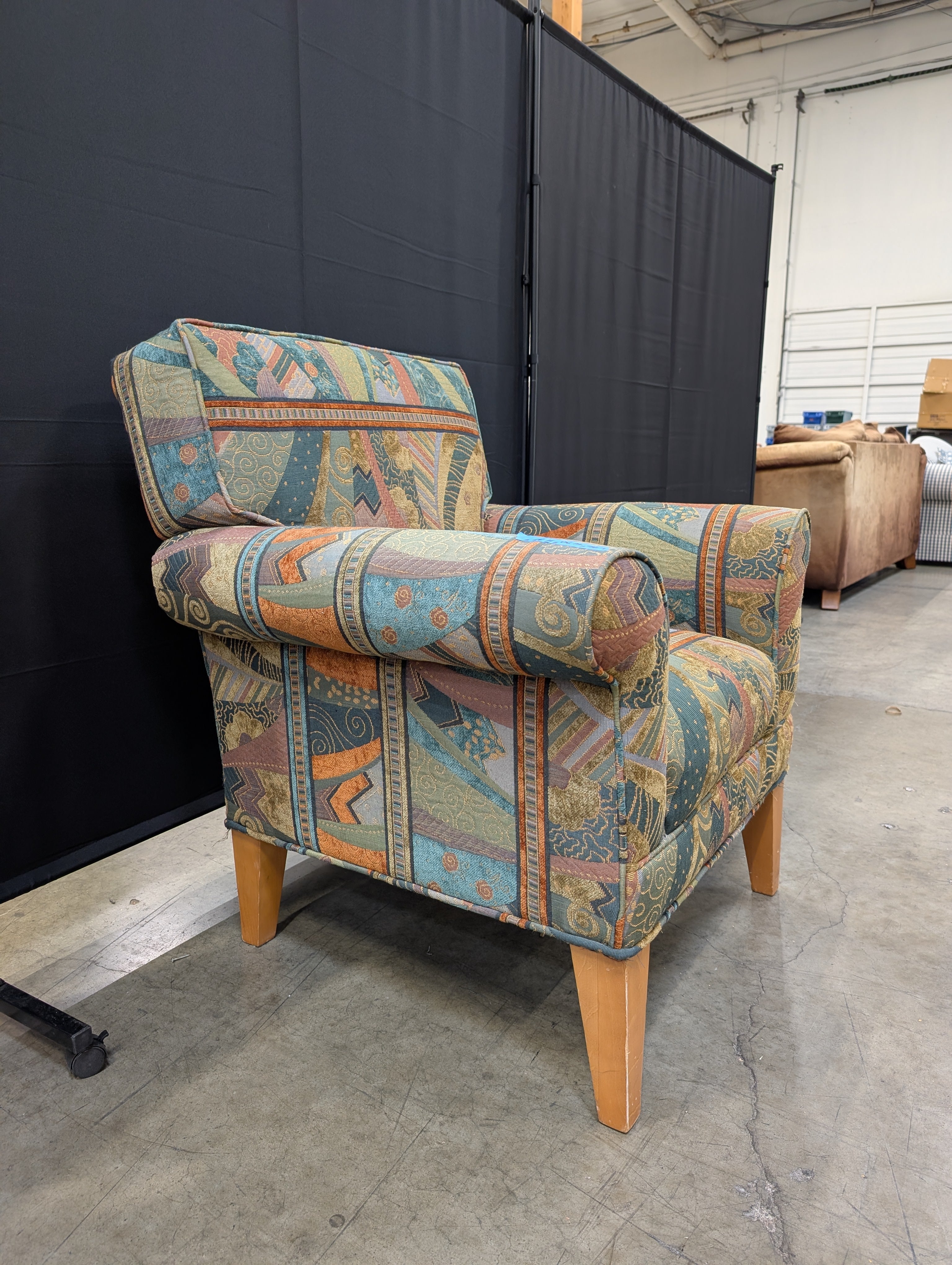 Vibrant Multi-Color Upholstered Armchair Cushion with Eclectic Pattern