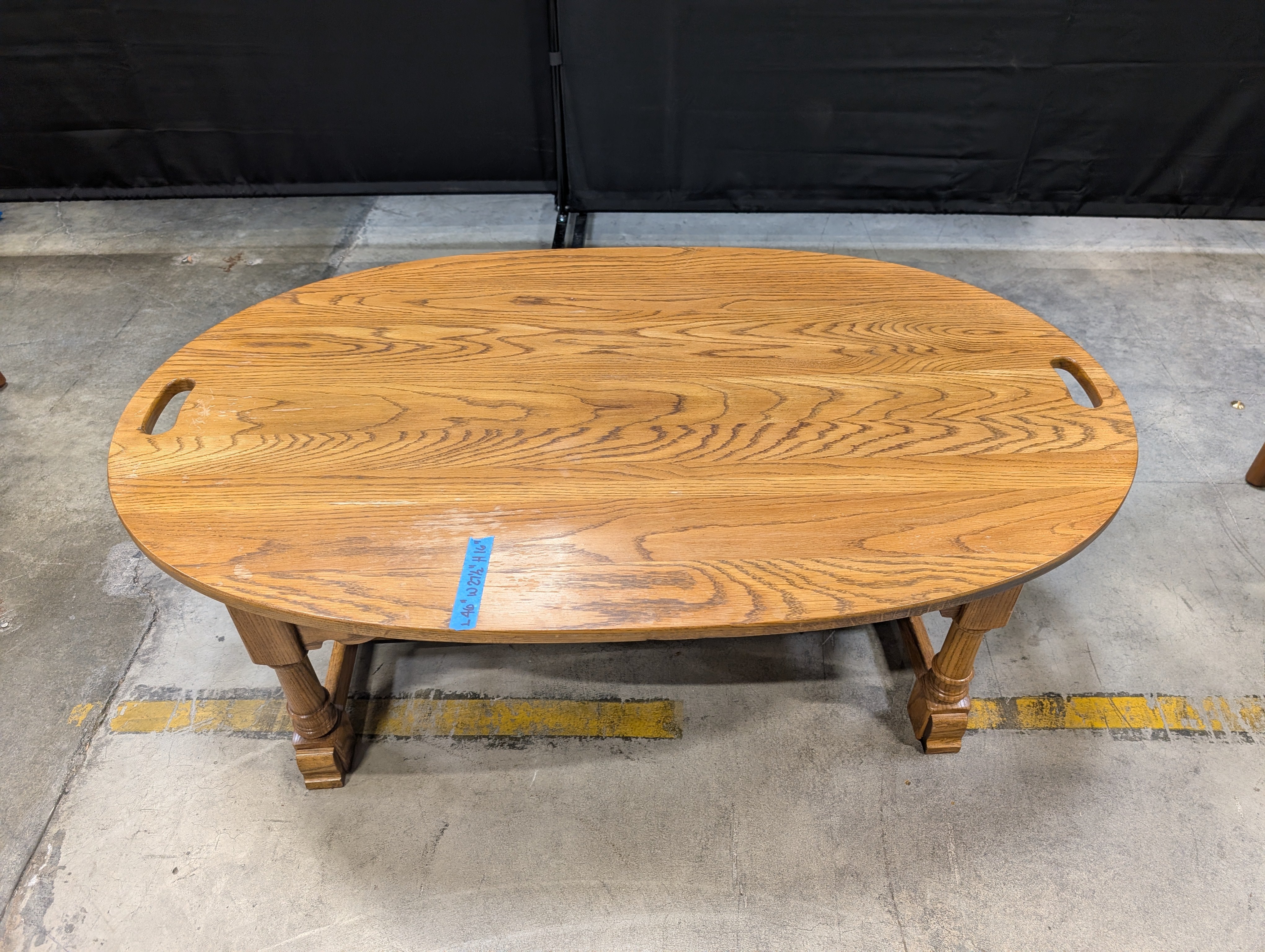 Oval Light Brown Wood Coffee Table with Cut-Out Handles