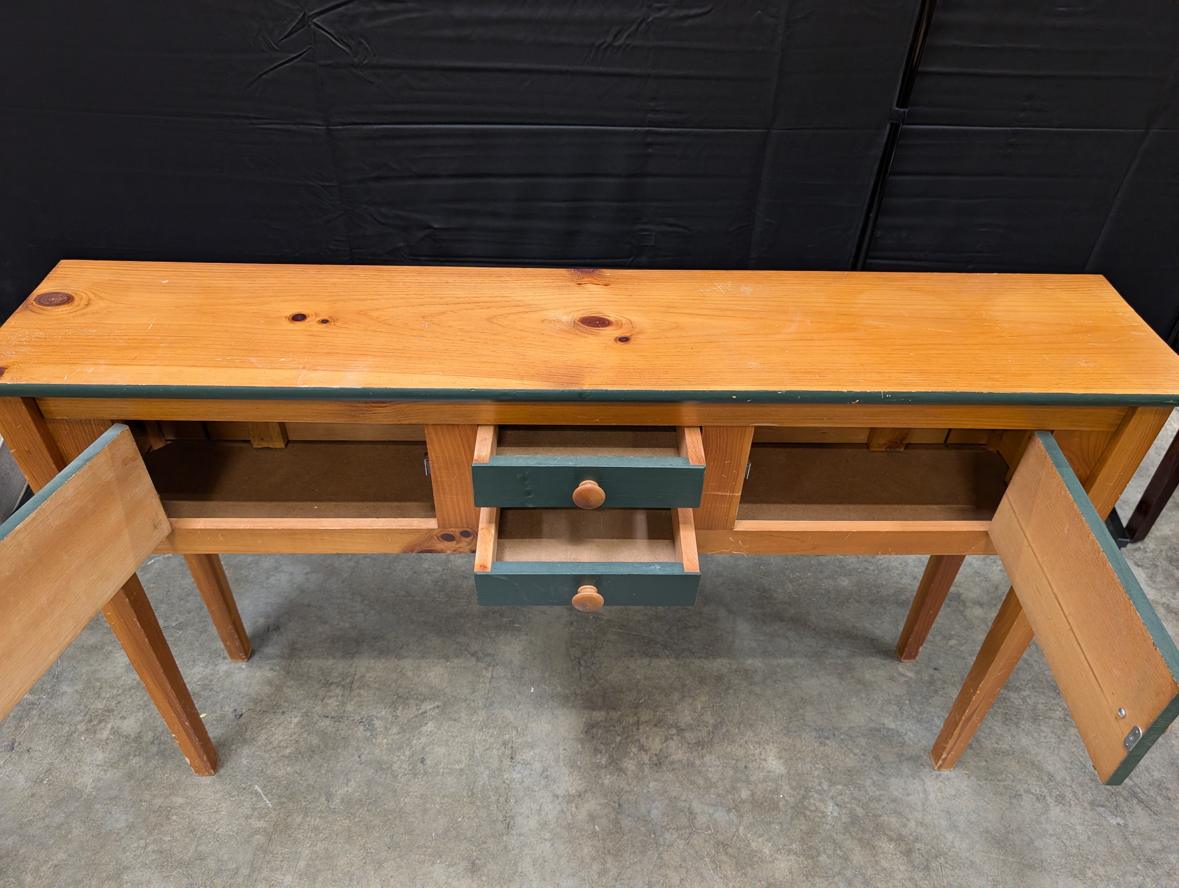 Rustic Wood Console Table with Dark Green Cabinetry