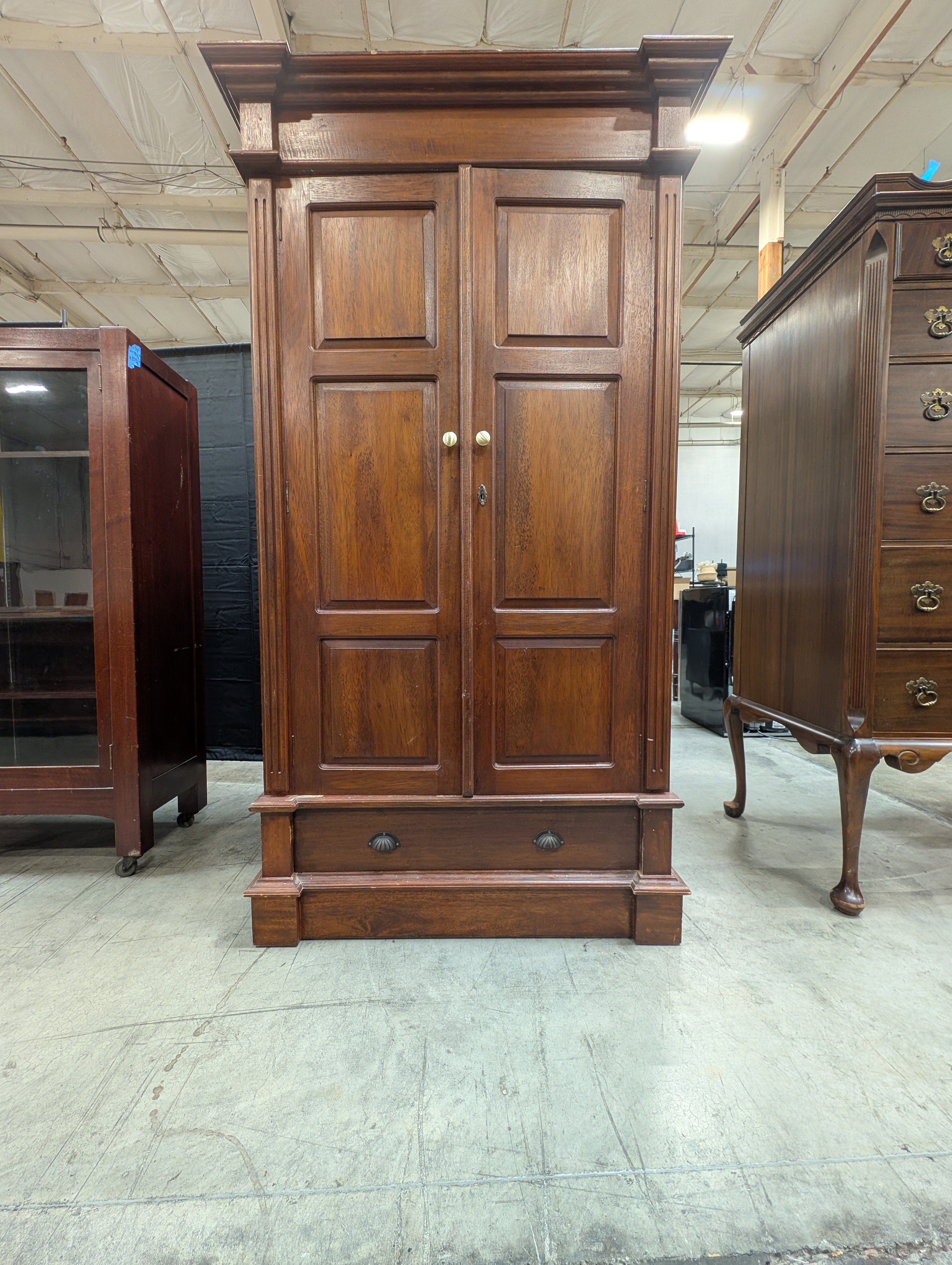 Stately Dark Wood Paneled Armoire with Drawer