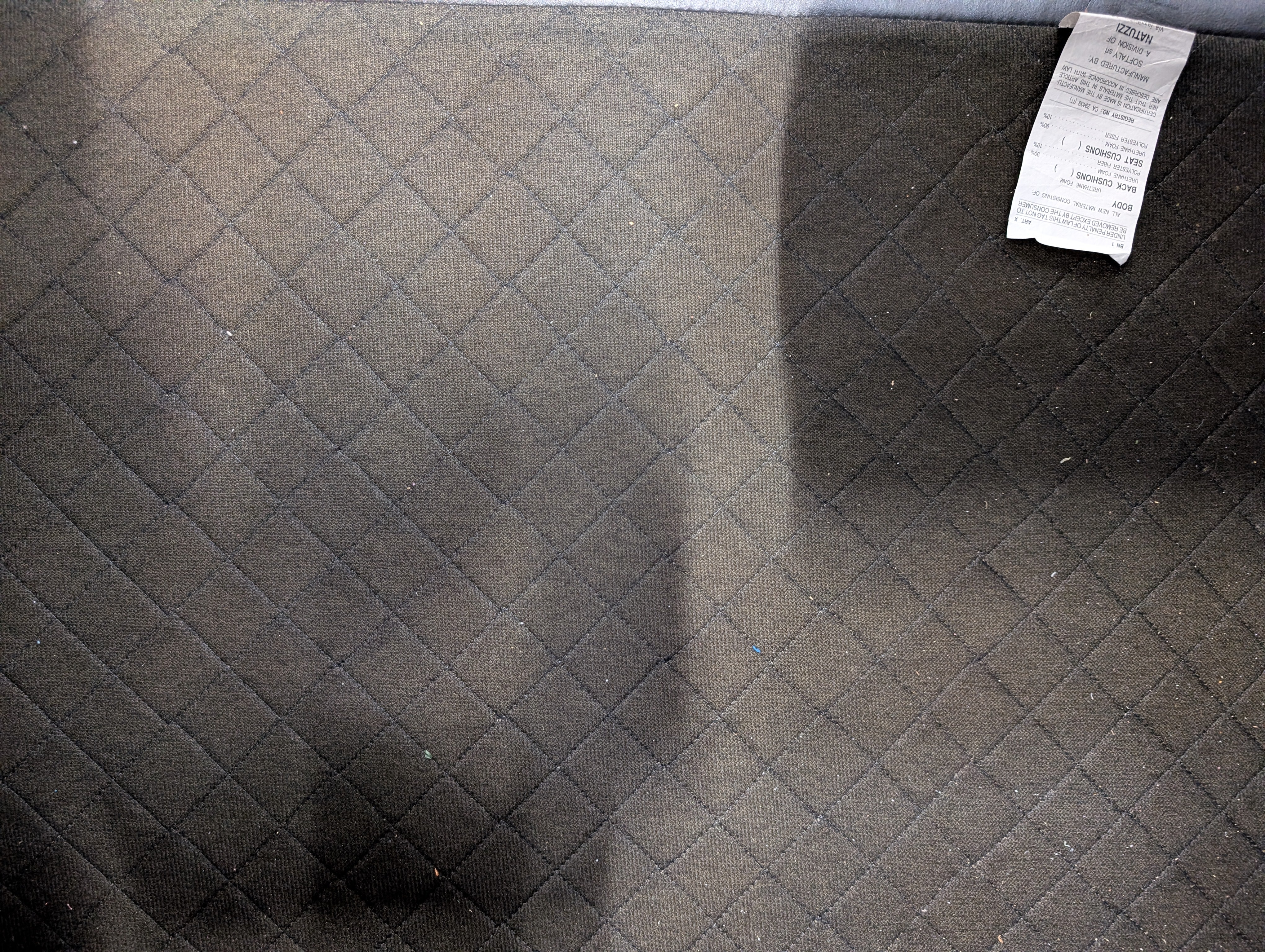 Natuzzi Spacious Black Leather Three-Seater Sofa with Ottoman