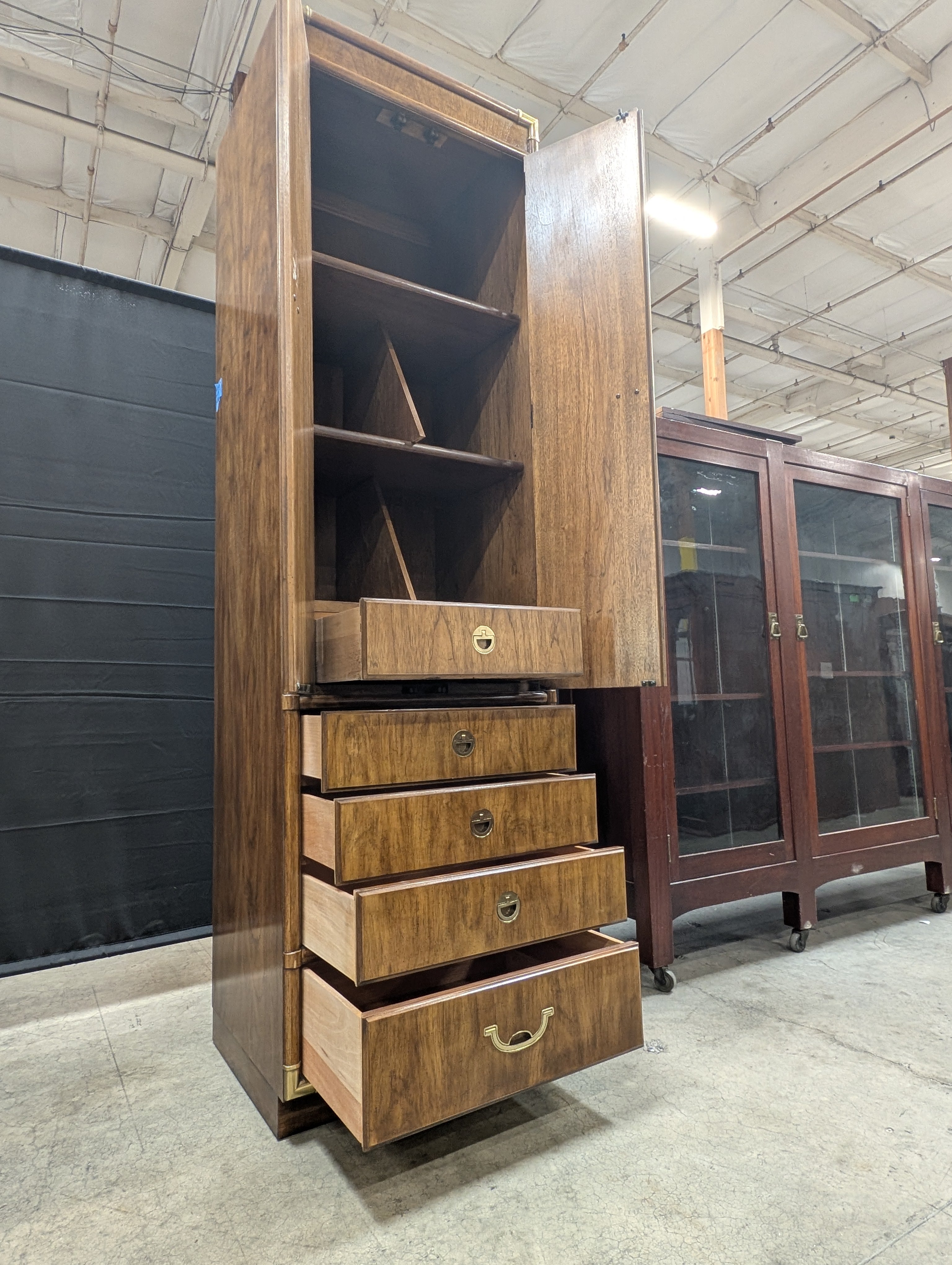 Tall Wooden Drexel Cabinet with Brass Accents and Multiple Drawers