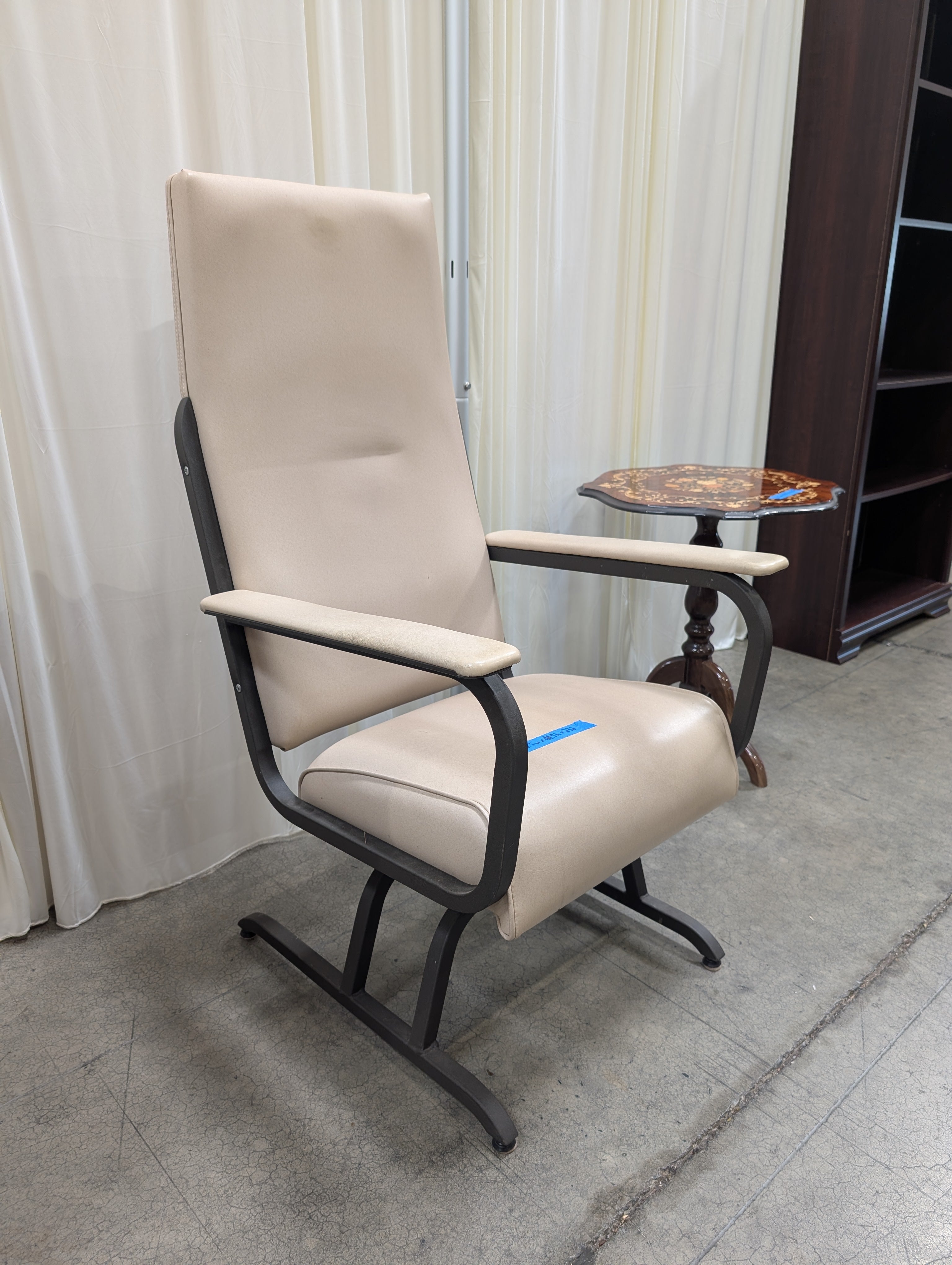 Cream Upholstered High-Back Chair with Metal Frame