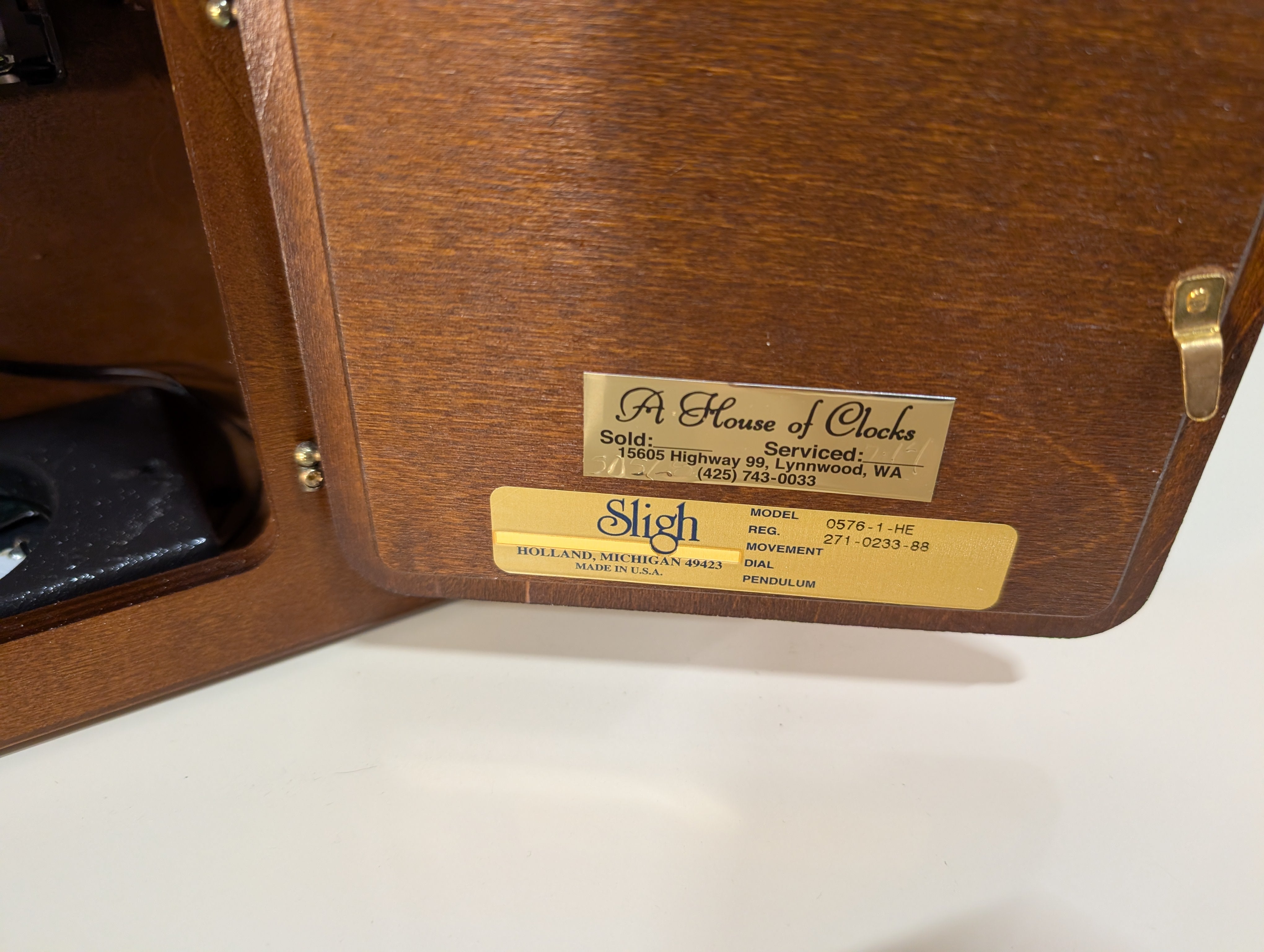Curved Dark Wood Table Clock with Brass Tone Bezel
