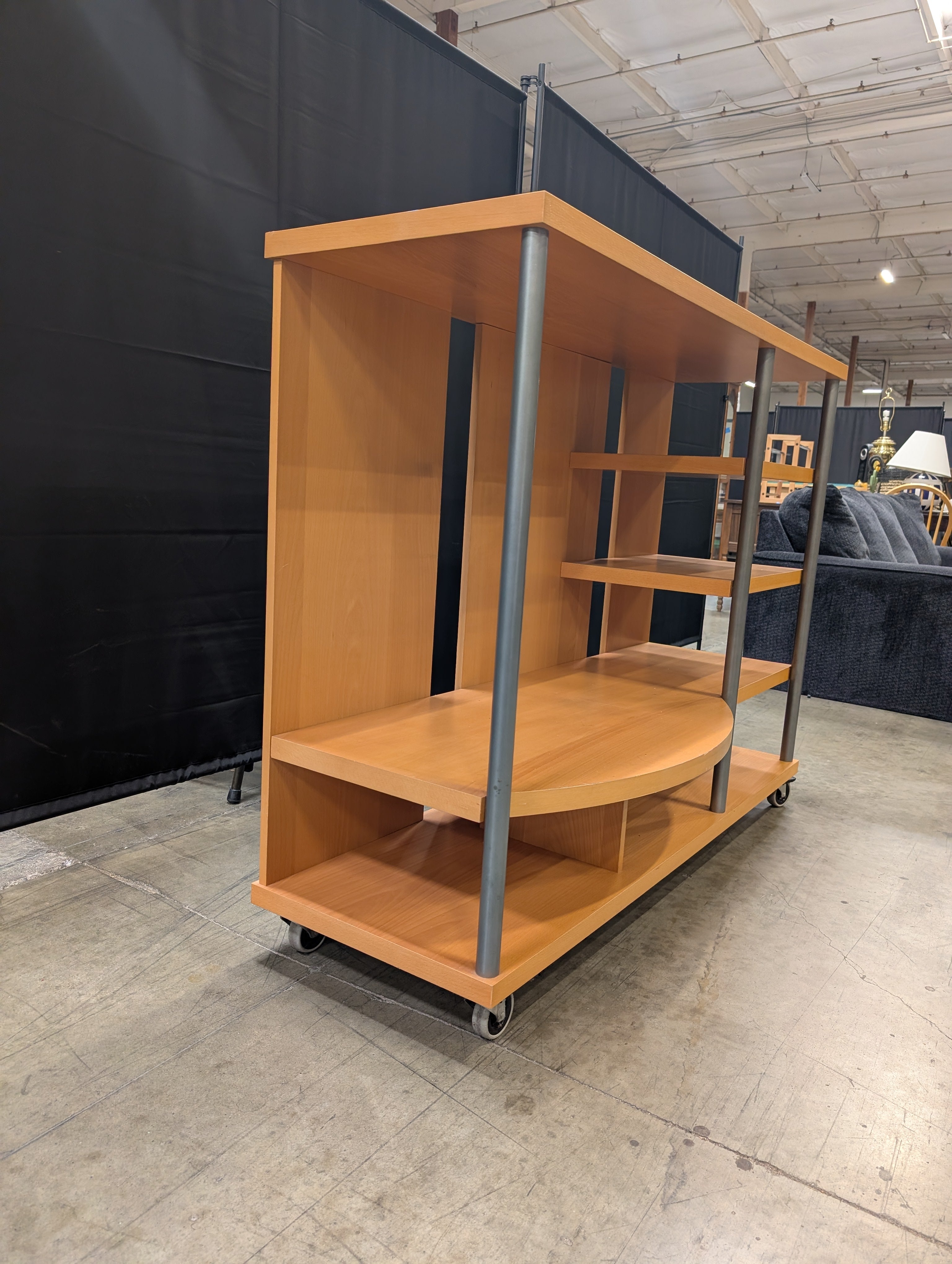 Contemporary Wood Tone Shelving Unit with Metal Supports and Casters
