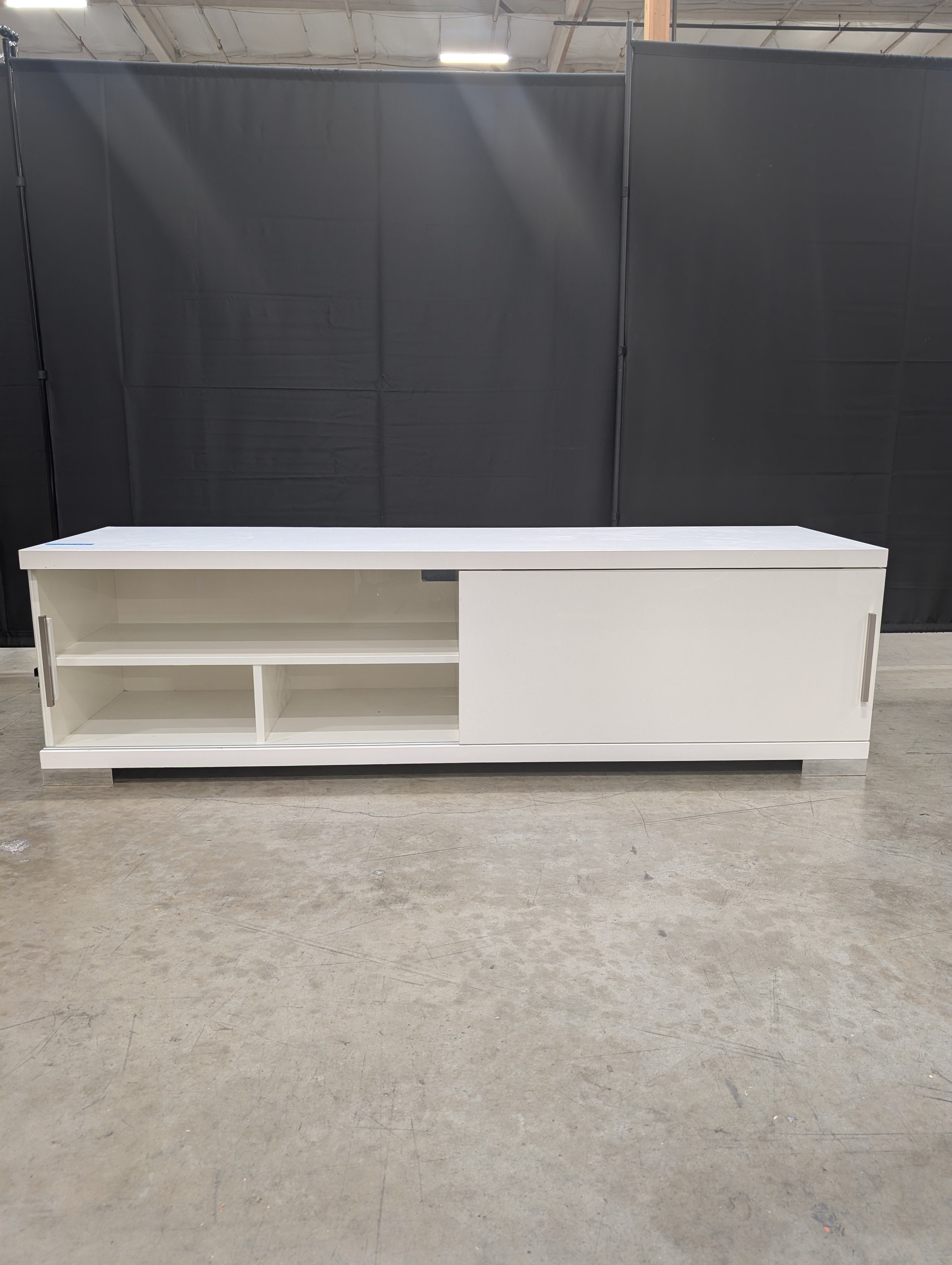 Sleek White Entertainment Unit with Sliding Doors