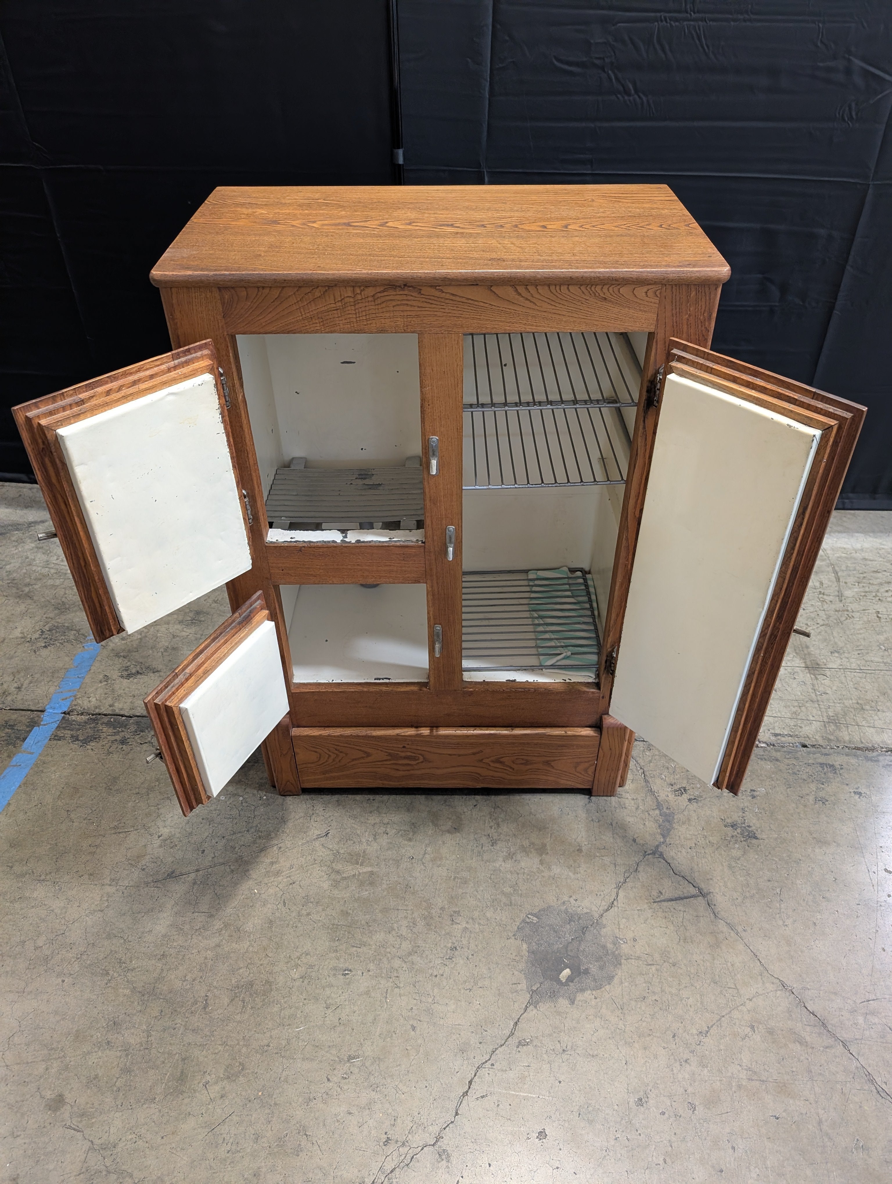 Rustic Wood Storage Cabinet with Paneled Doors and Metal Latches