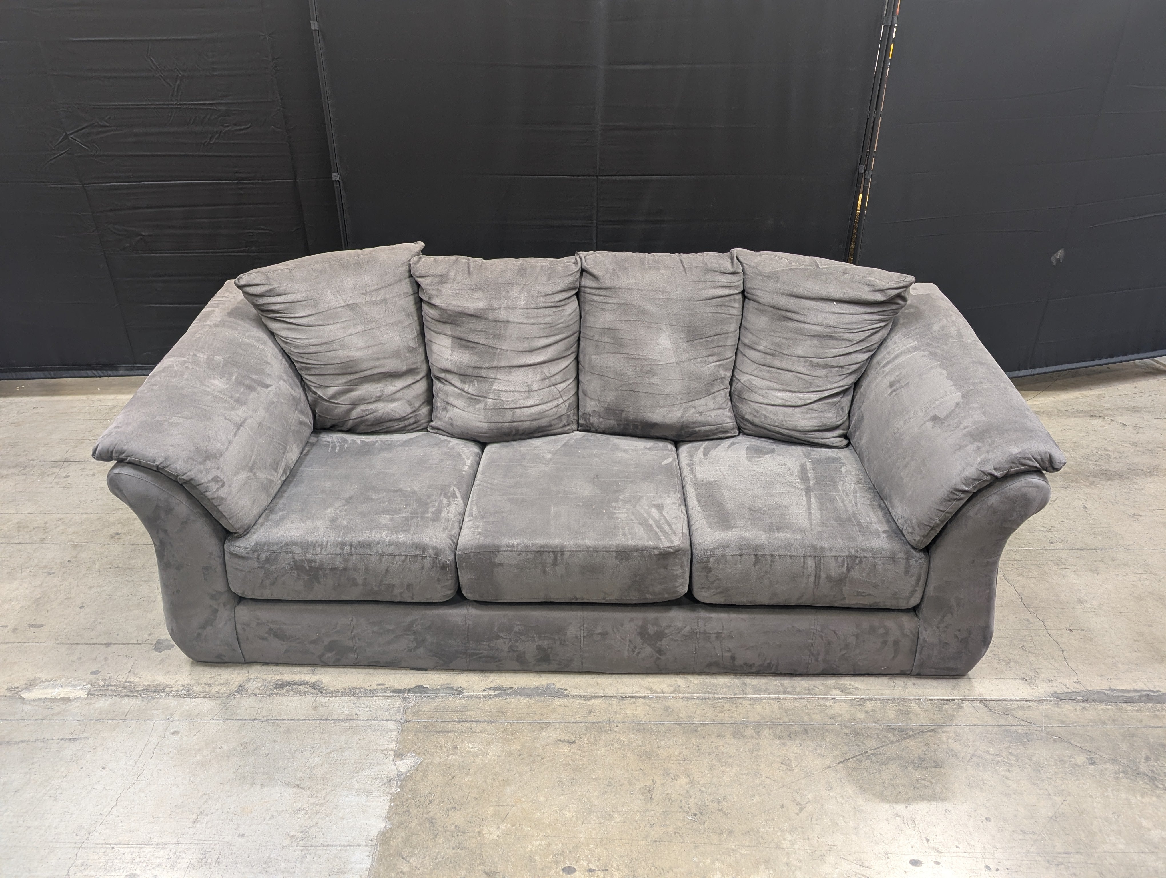 Spacious Three-Seater Grey Upholstered Sofa