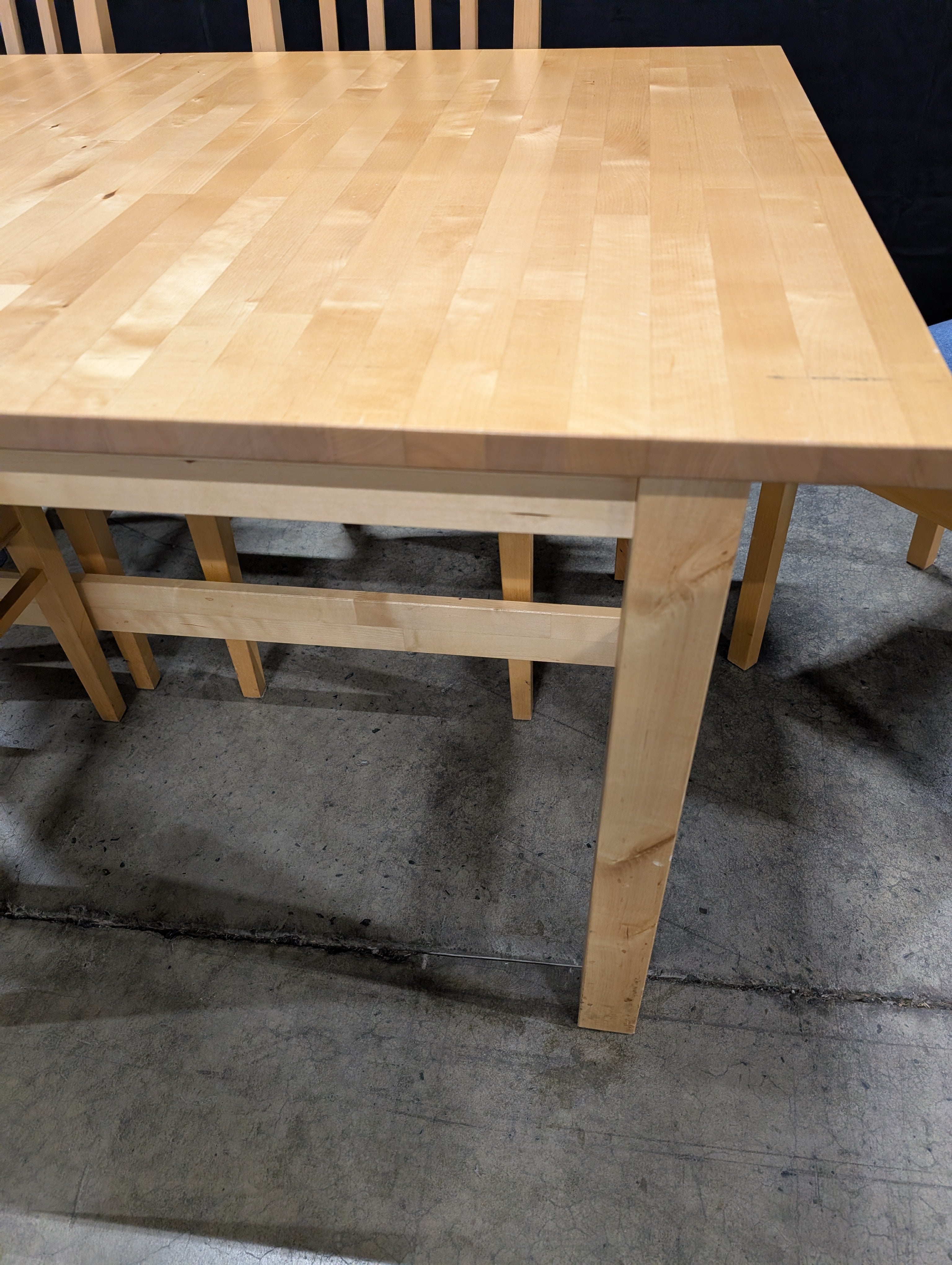 Versatile Extendable Light Wood Dining Table with Six Blue Upholstered Chairs