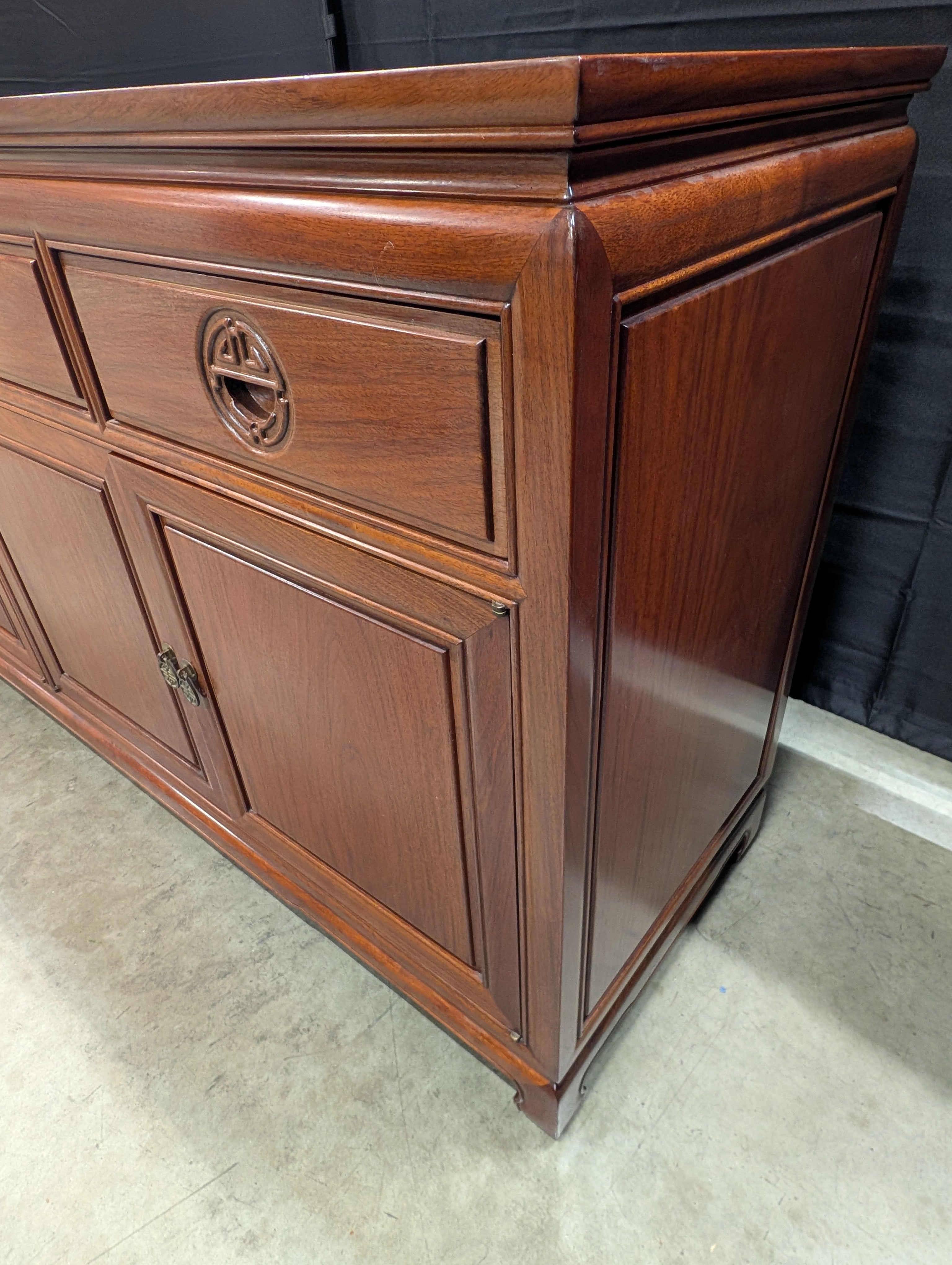 Rich Toned Wooden Sideboard with Carved Accents