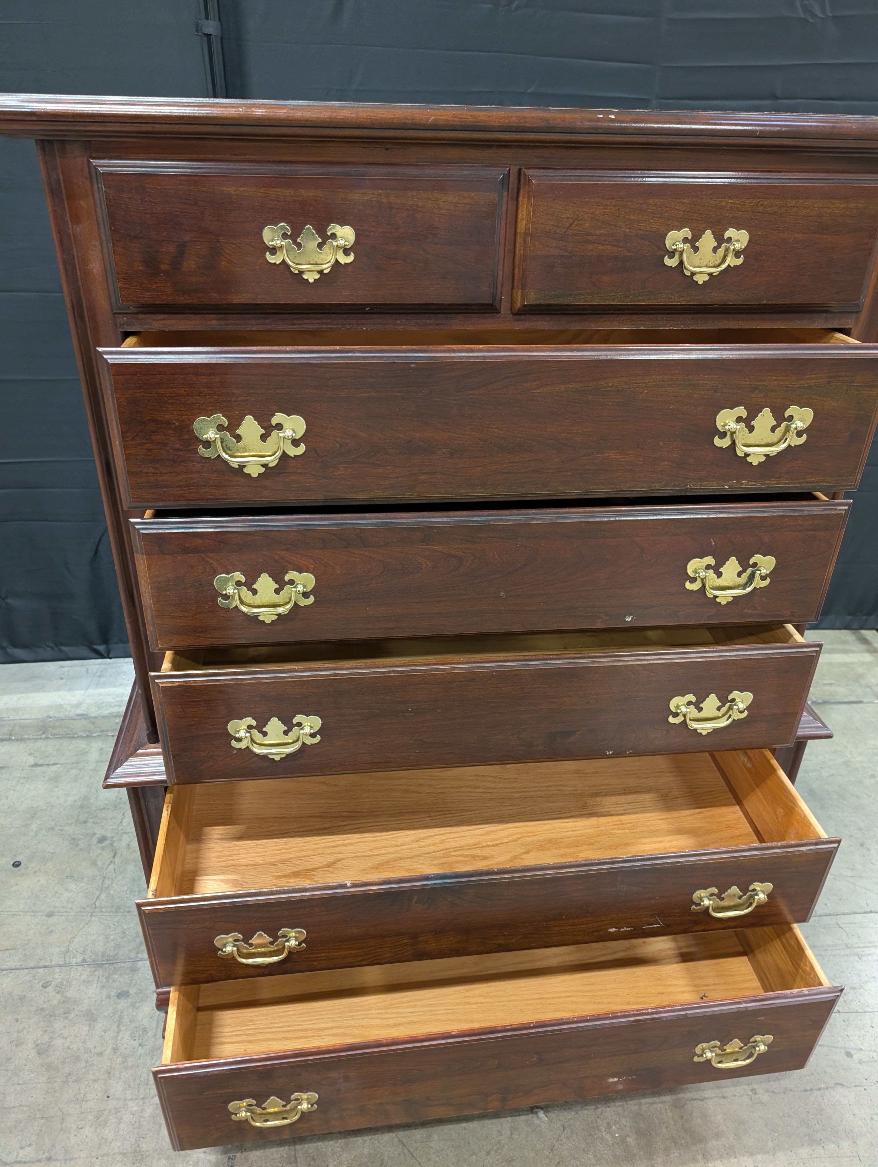 Traditional Dark Wood Chest of Drawers with Ornate Brass Pulls