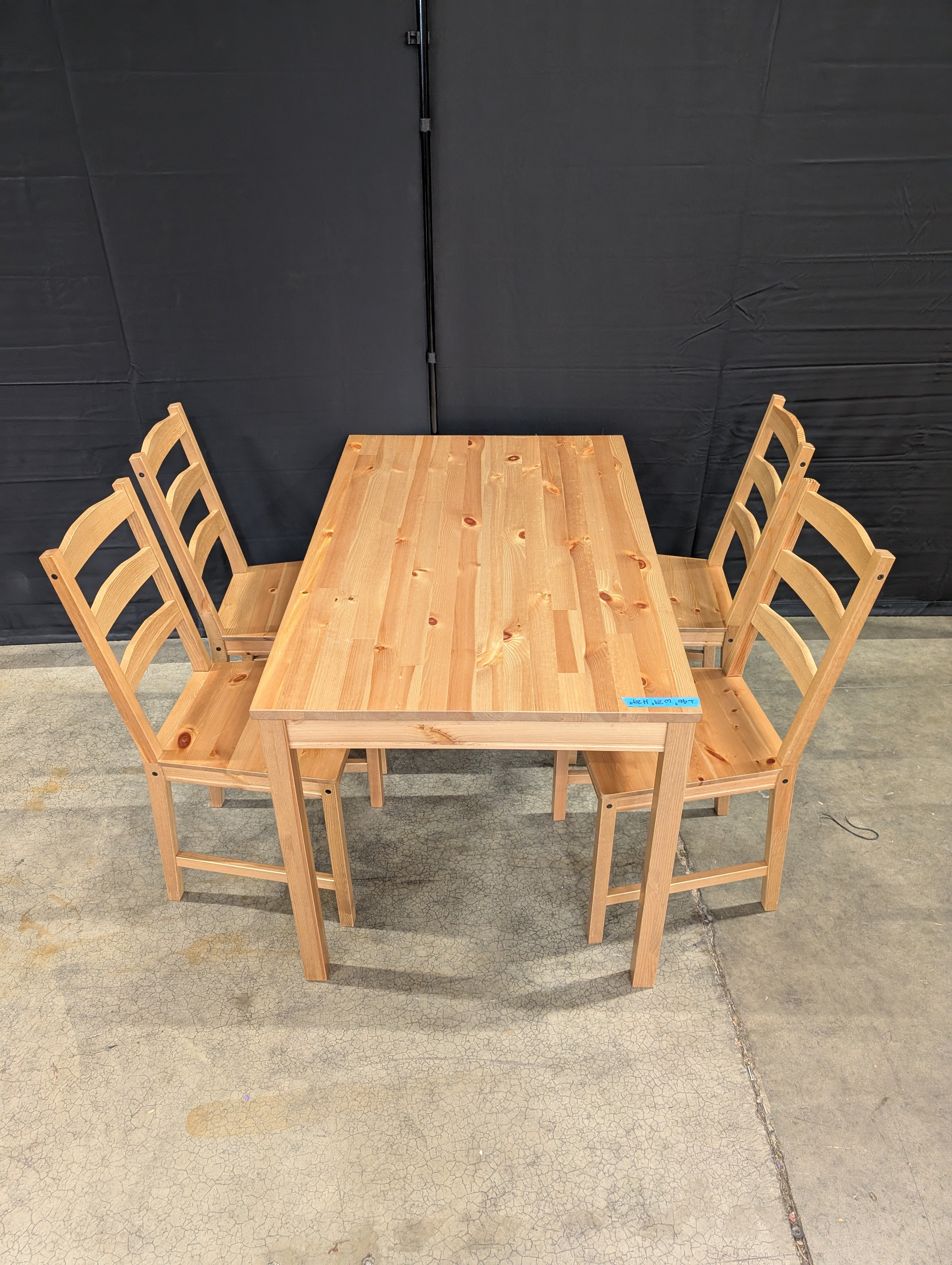 Natural Wood Plank Dining Table with Four Ladder Back Chairs