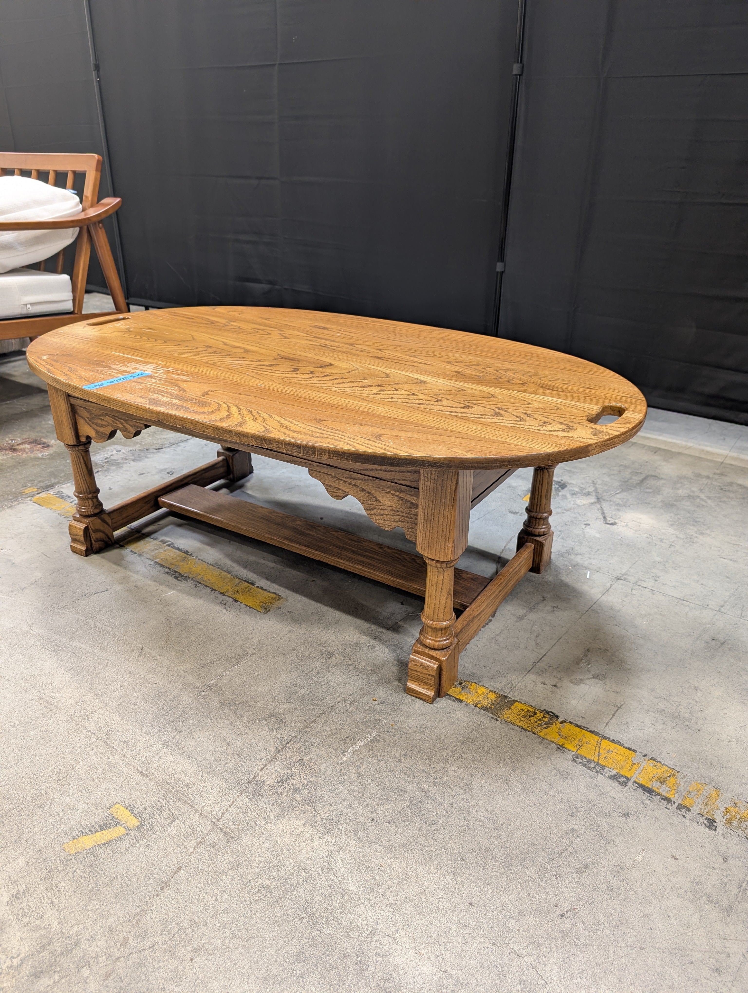 Oval Light Brown Wood Coffee Table with Cut-Out Handles