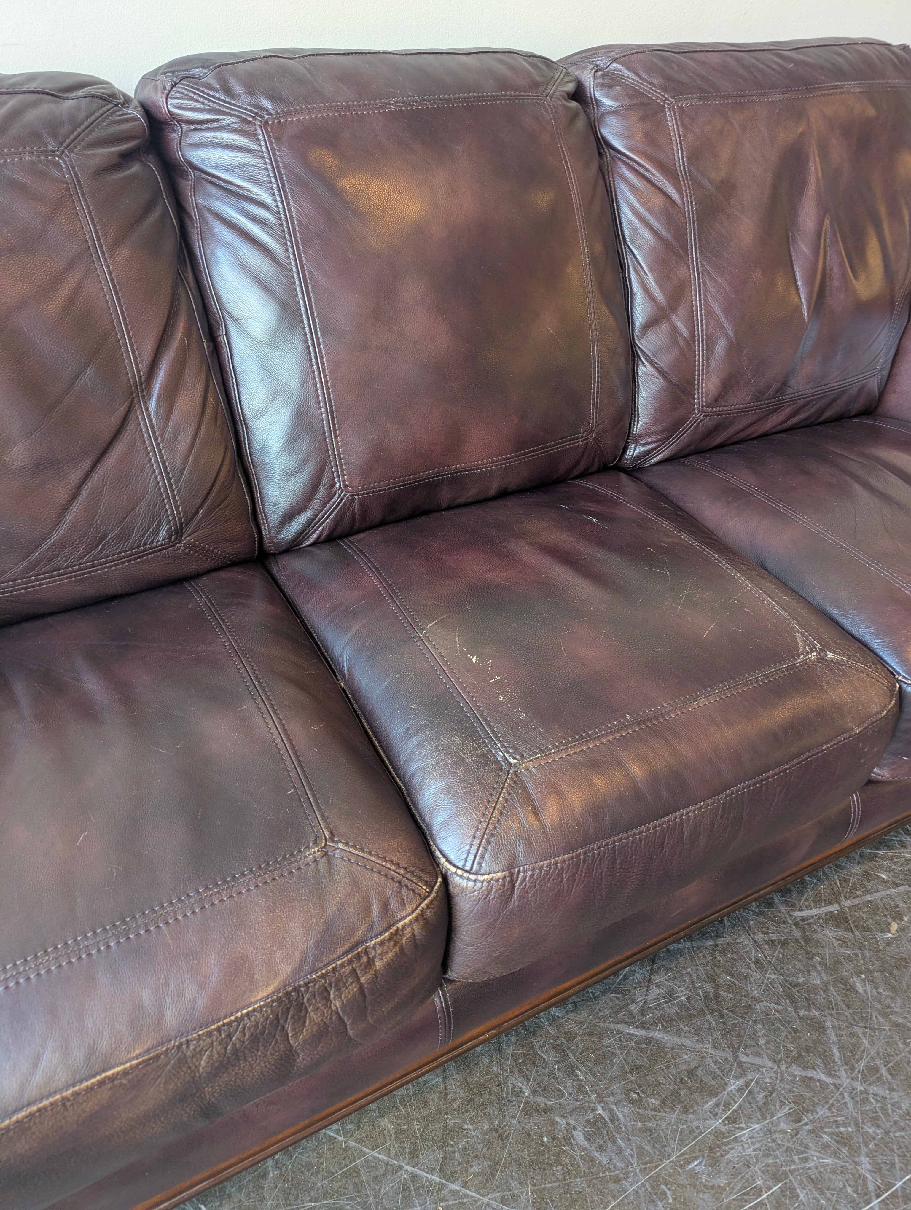 Classic Burgundy Leather Three-Seater Sofa with Rolled Arms