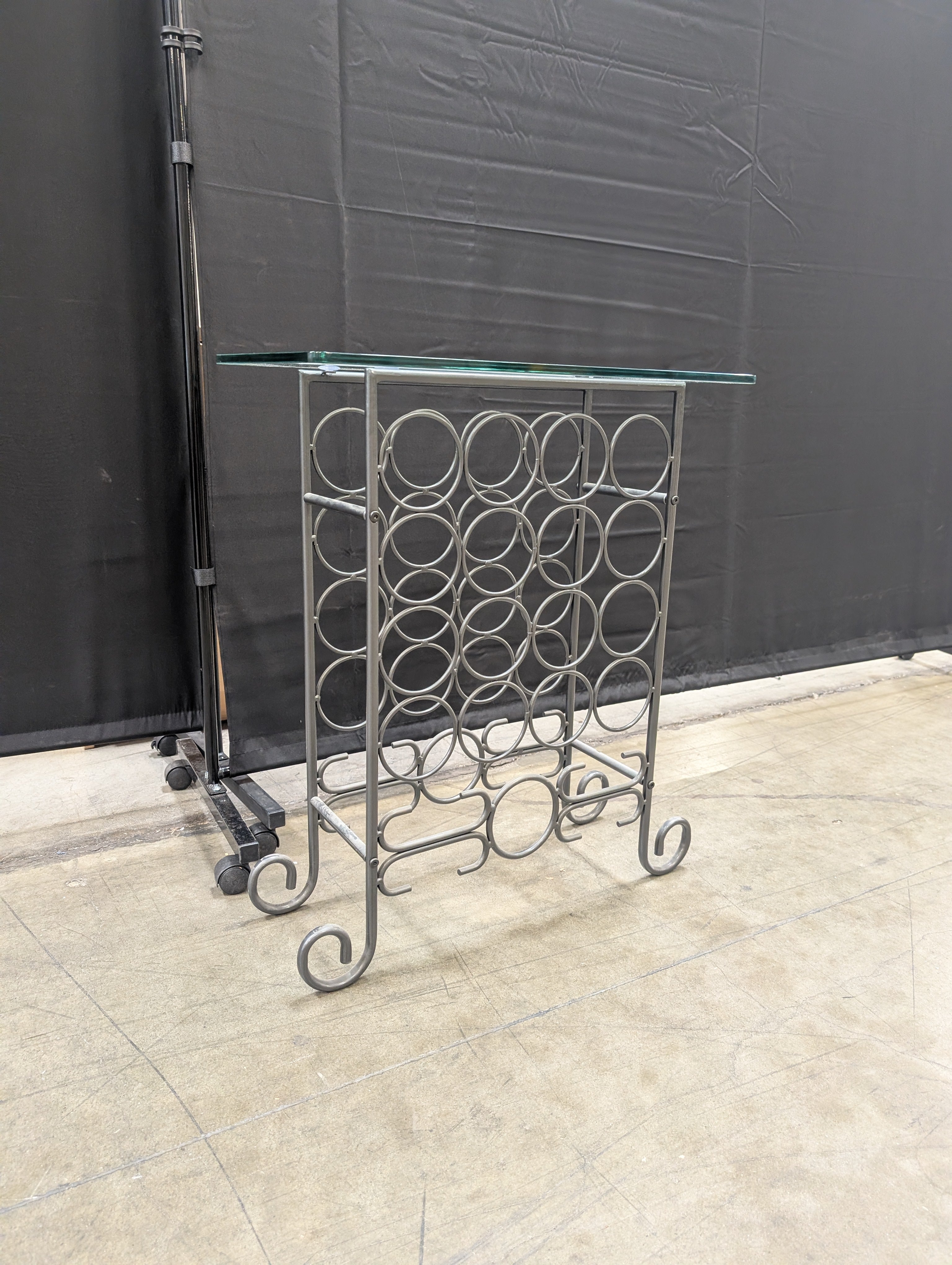 Industrial Style Metal Wine Rack with Glass Top and Wheels